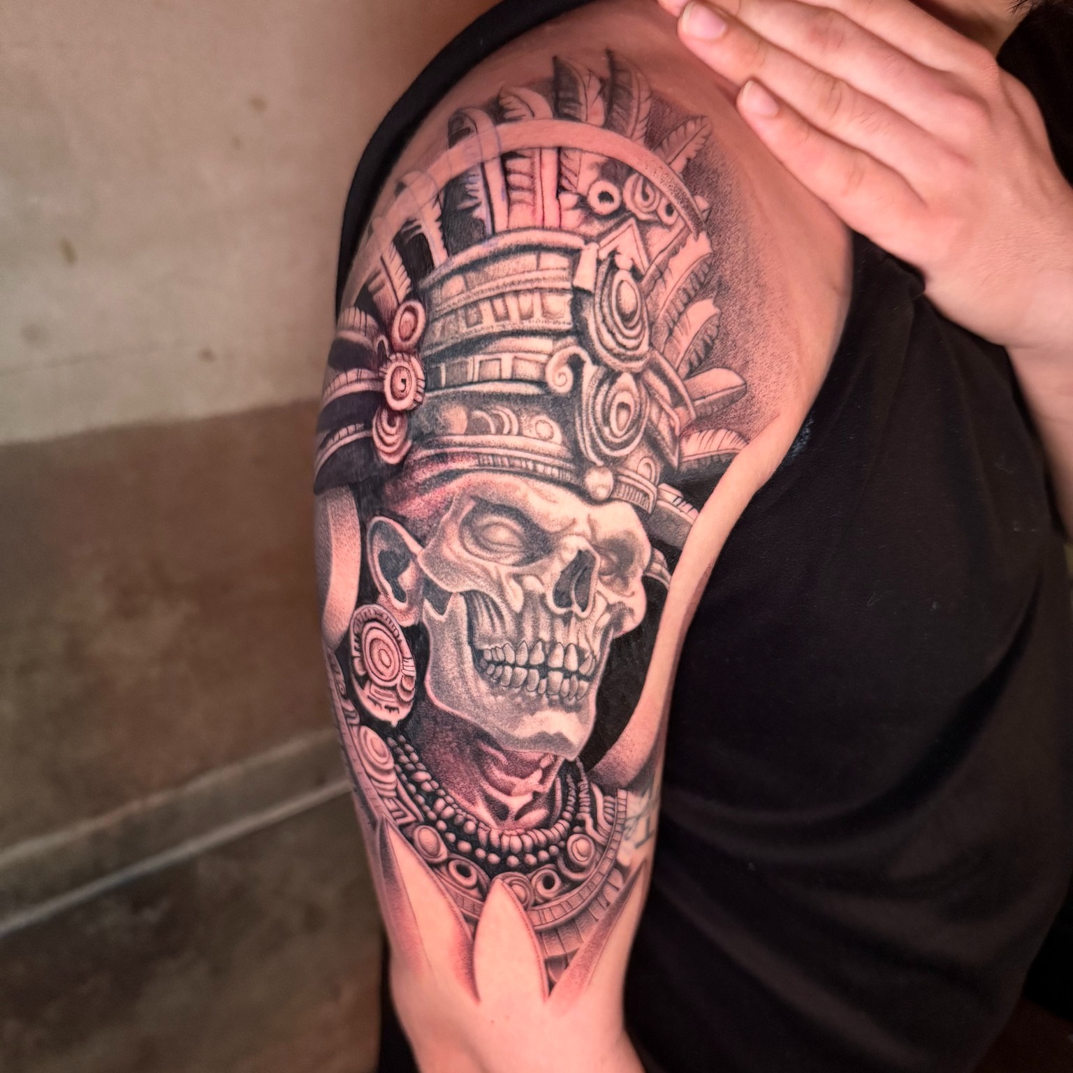 Skull with headdress realism tattoo on the shoulder by Tattoo Artist Vanessa
