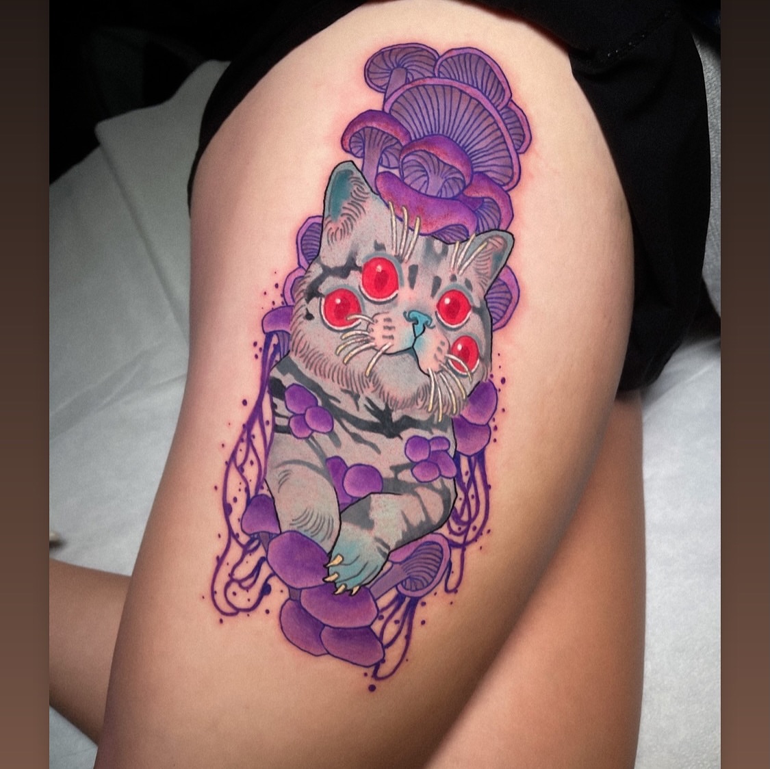 Cat with mushrooms dotwork tattoo on the thigh by Igor Puente
