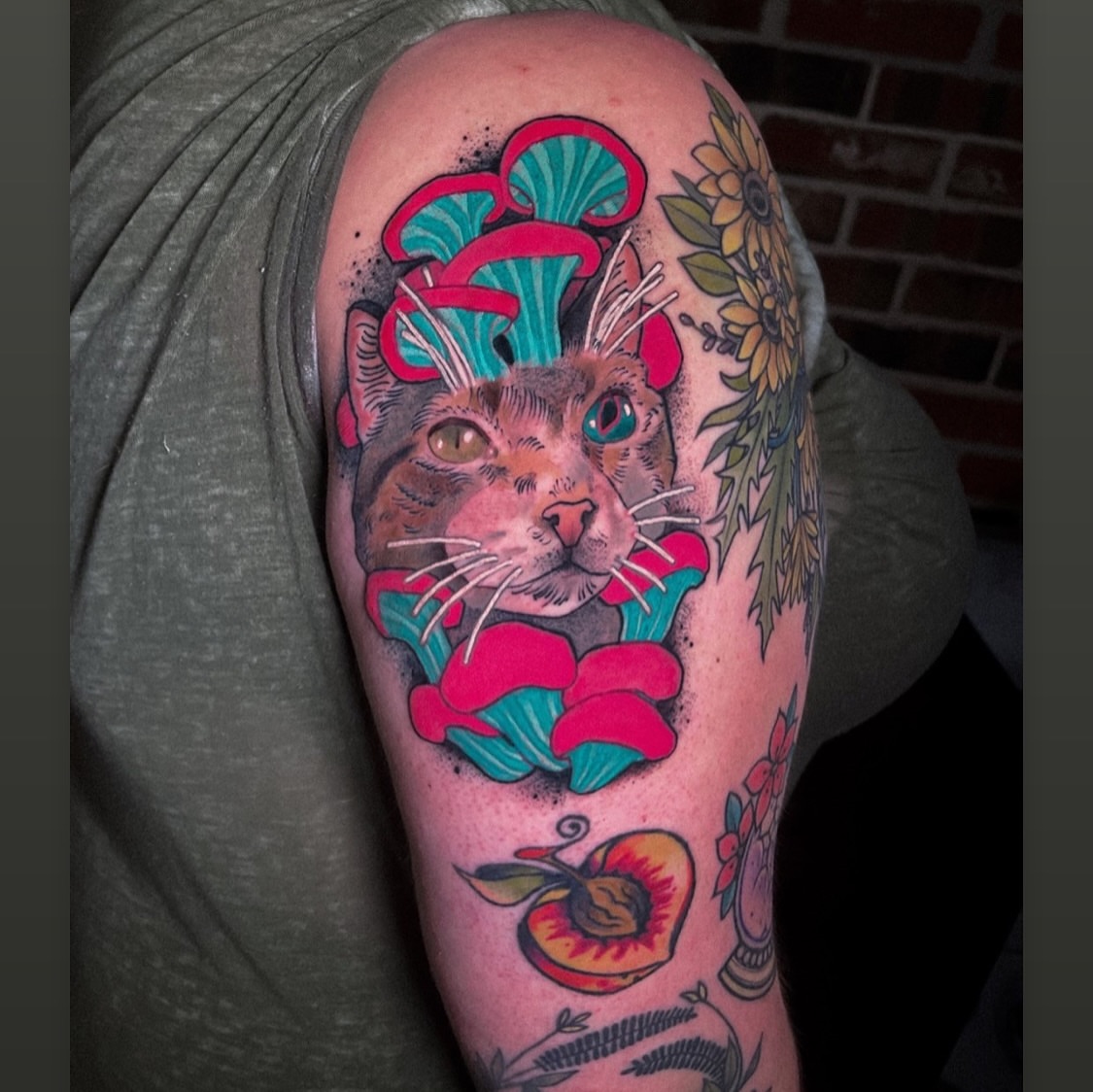Cat with mushrooms American traditional tattoo on the forearm by Igor Puente