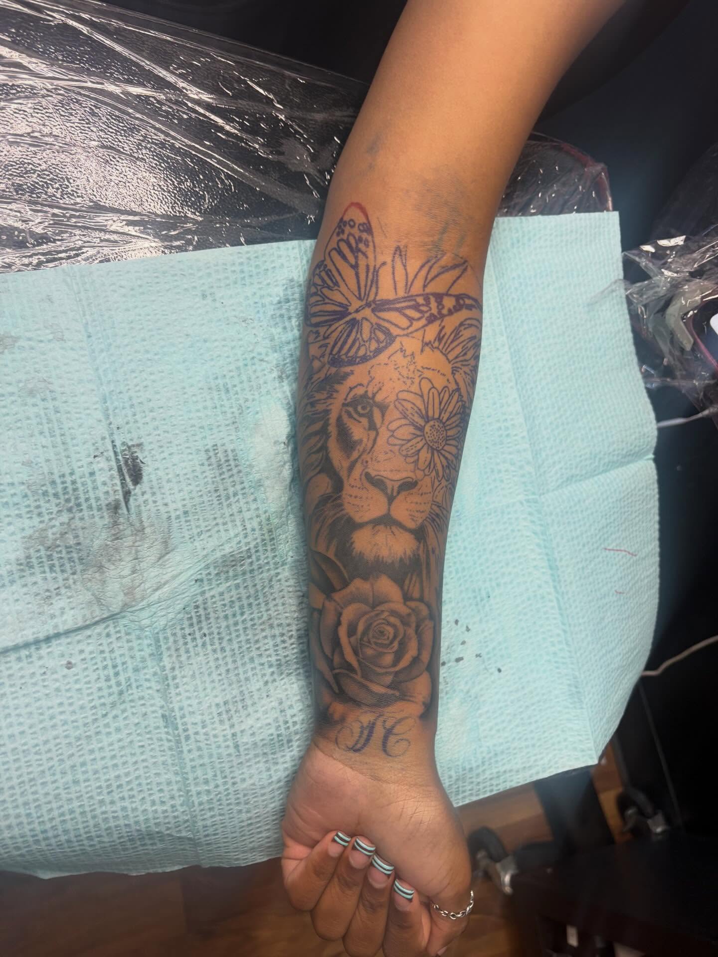Lion and rose realism tattoo on the forearm by 𓂀 𝕊ℍ𝔼𝕃𝕃𝕐 𓂀