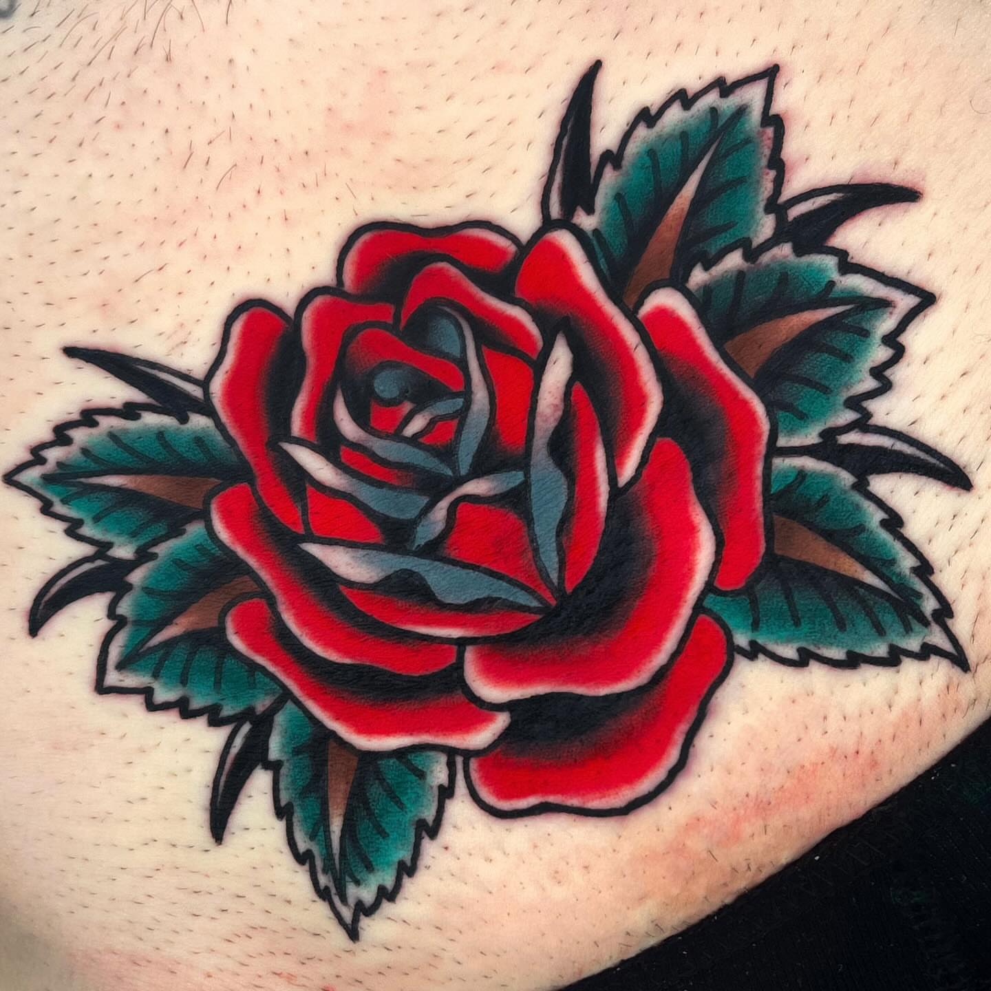 Red rose American traditional tattoo by Sky G, Colorado Springs, Colorado