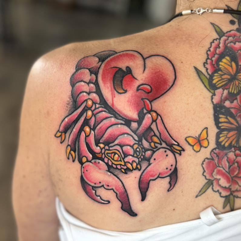 Scorpion and heart American traditional tattoo on the shoulder by Tattoos by Aeron Herald Maurbjorn, Sioux