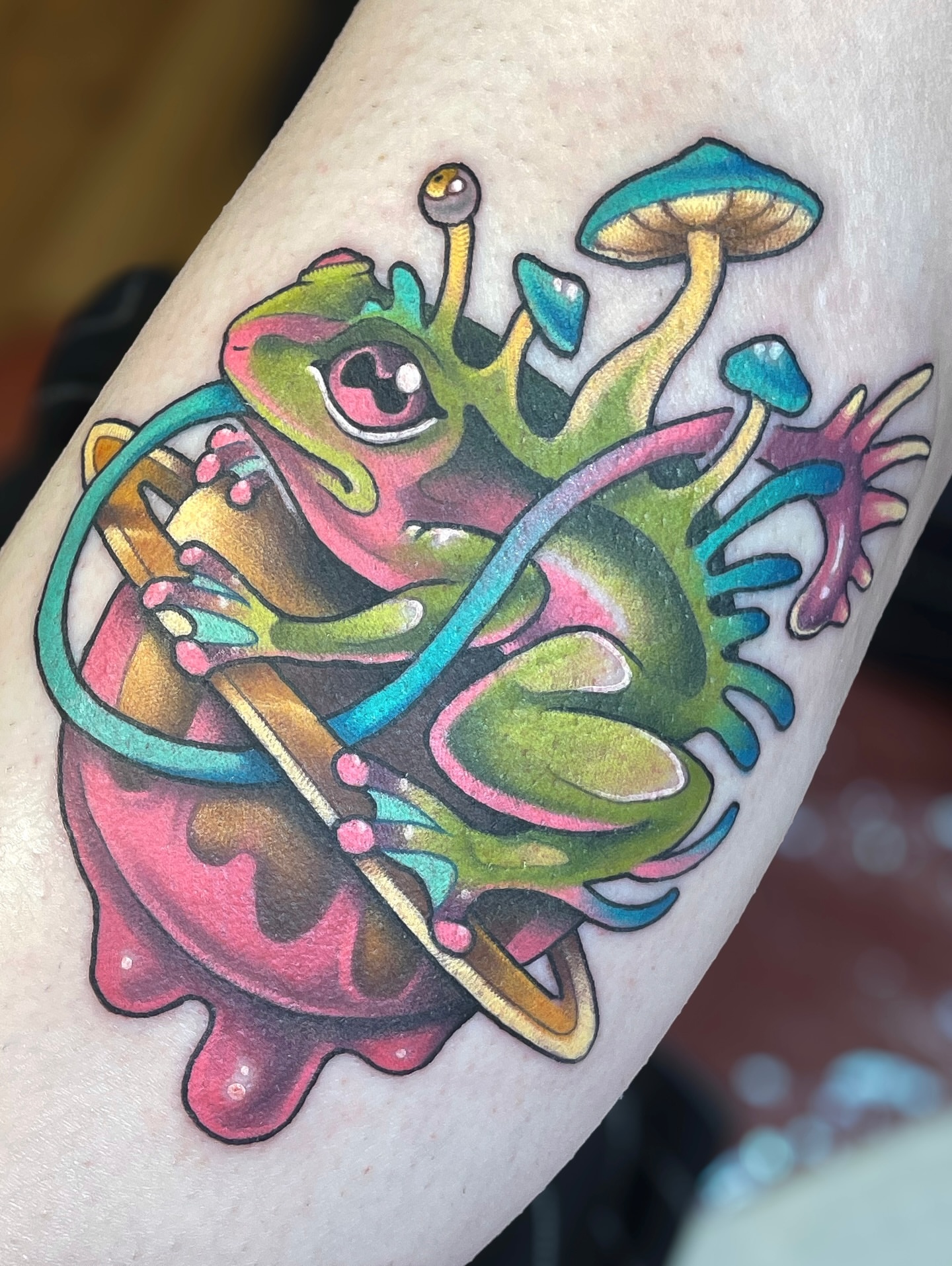 Frog new school tattoo on the forearm by Corra Carmine