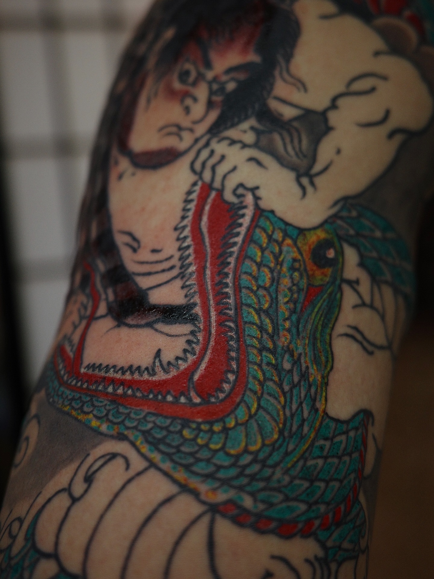 Samurai and dragon American traditional tattoo on the forearm by Innokenty Meshchakov, Portland, Oregon