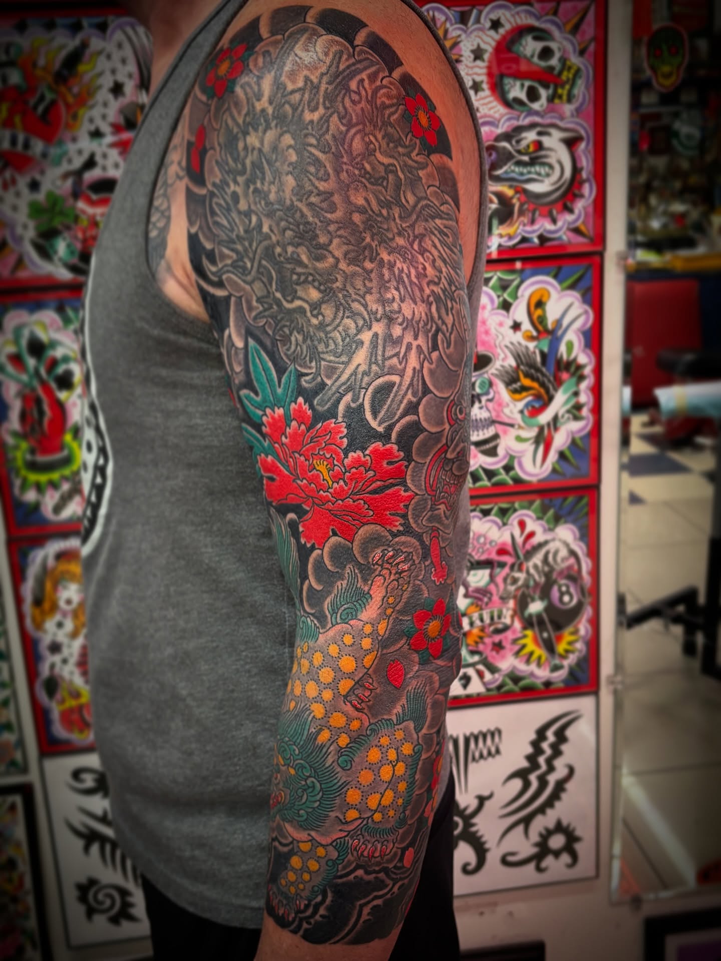 Peony and dragon japanese irezumi tattoo on the upper arm by Carlos Gonzalez Tattoo, Dallas, Texas