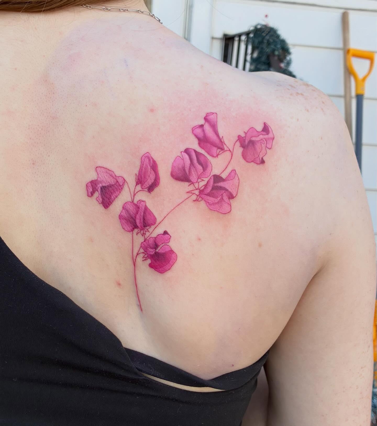 Sweet pea flowers realism tattoo on the shoulder by Linzi Hungerford, Bozeman, Montana