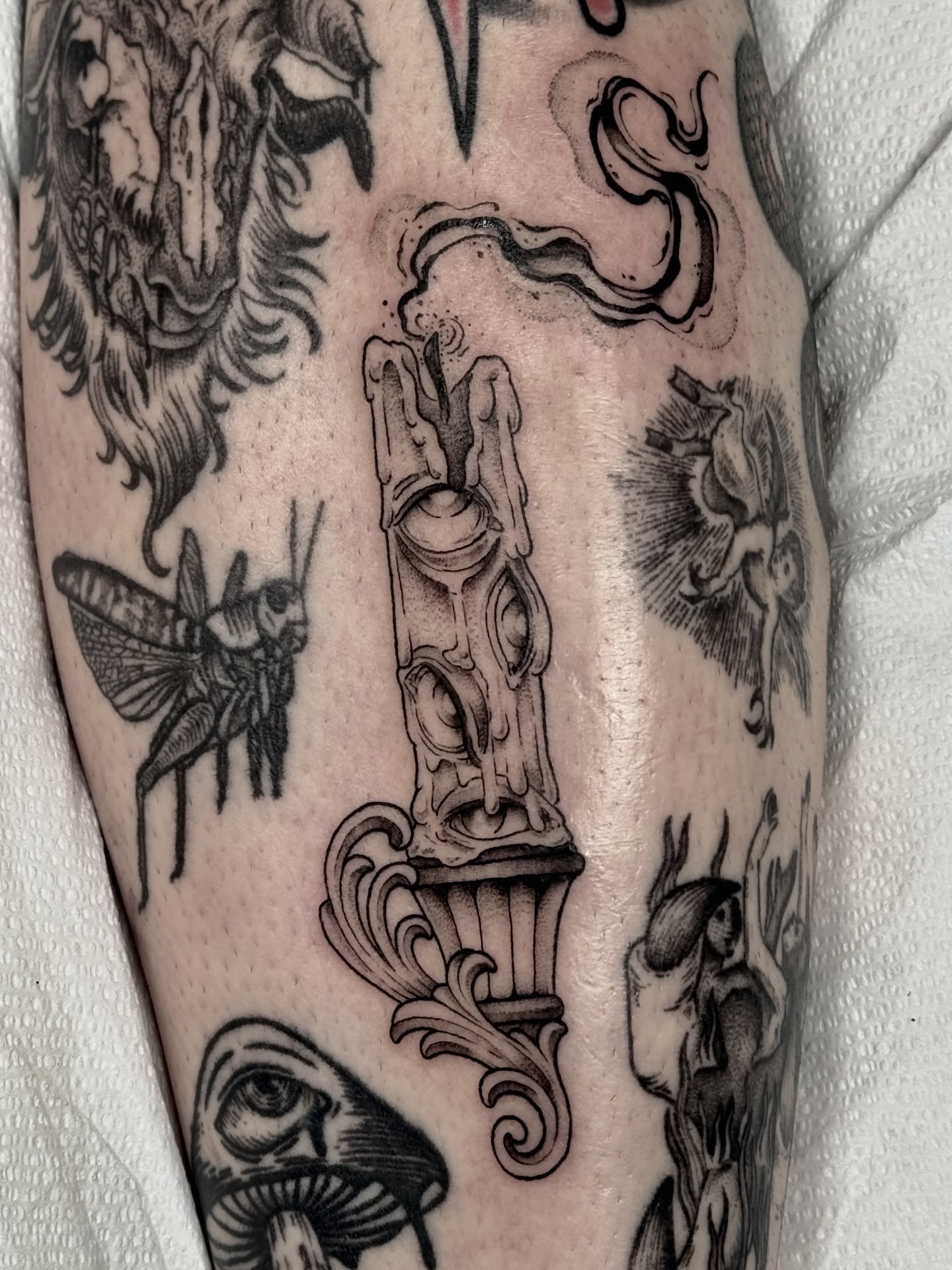 Statue and insects black and grey tattoo on the forearm by Hannah May, La Mesa, California