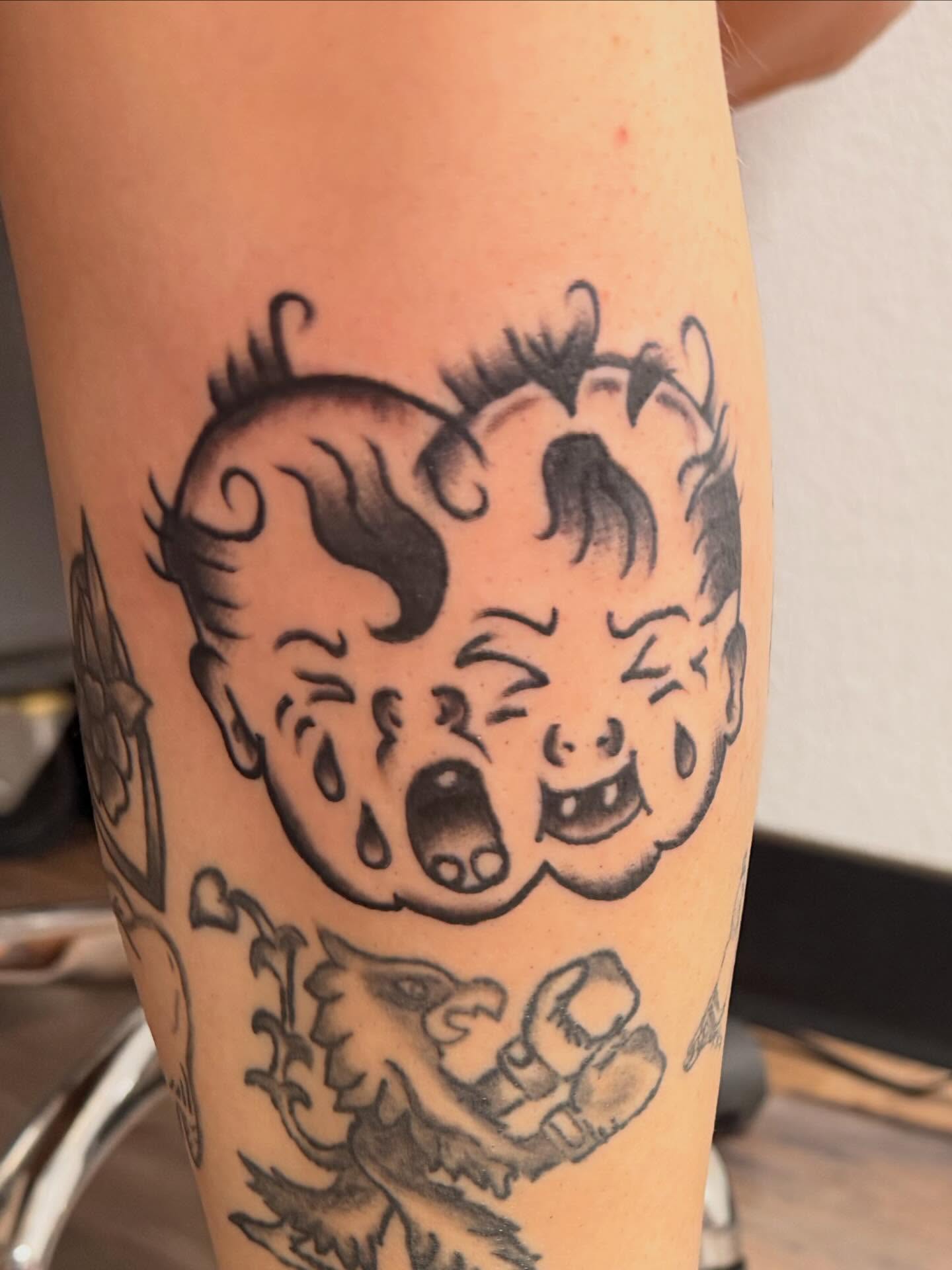 Angry baby American traditional tattoo on the forearm by cortez