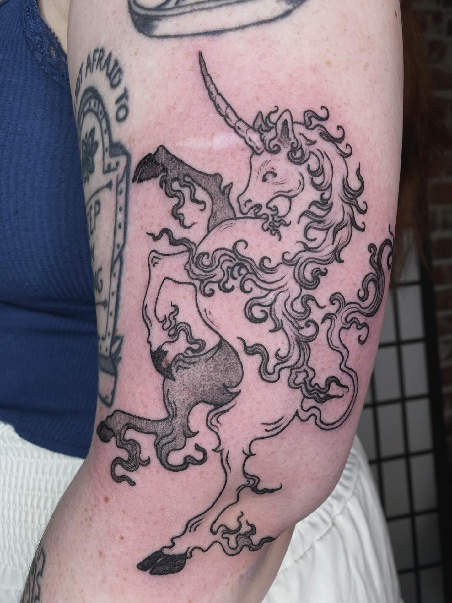 Unicorn black and grey tattoo on the forearm by sarah 🗝️