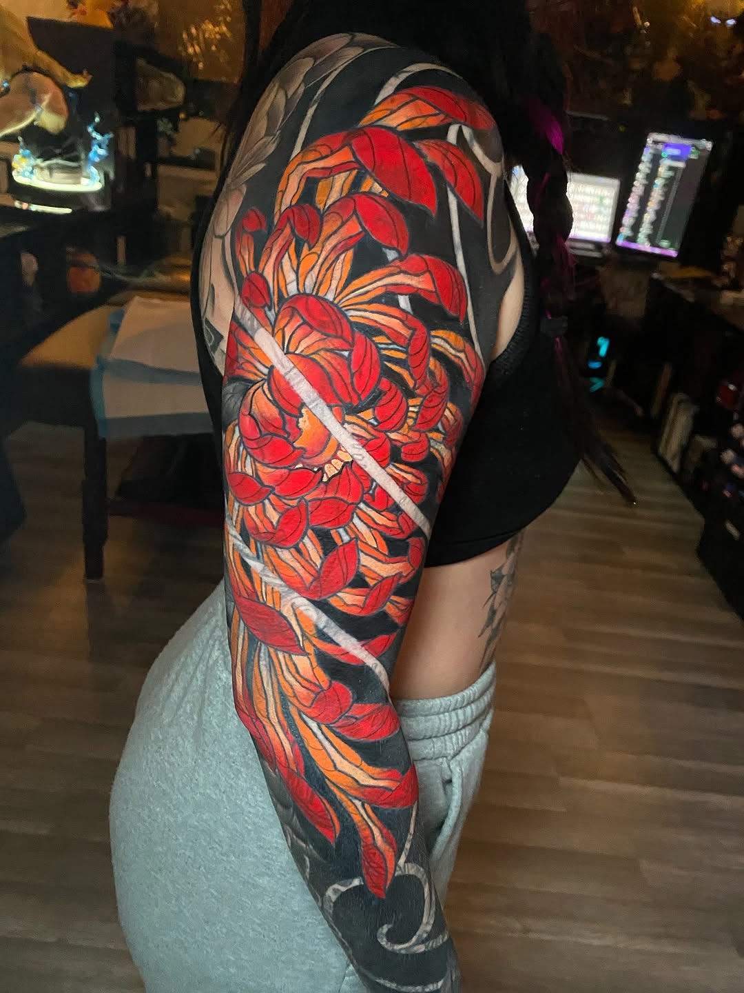 Chrysanthemum flower Japanese tattoo on the upper arm by Tattertot
