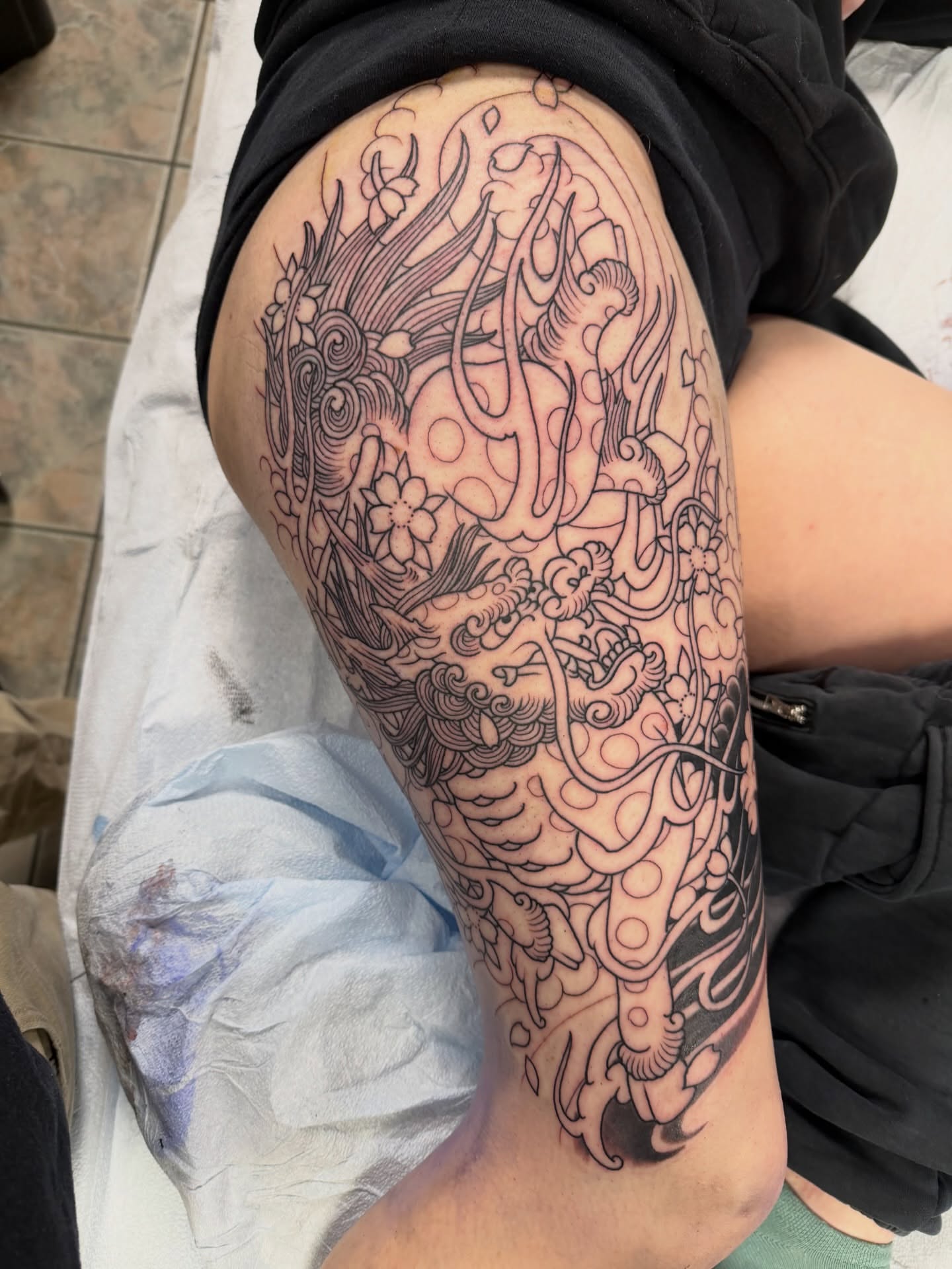 Dragon and waves japanese irezumi tattoo on the thigh by Corey Thompson, Butler, Pennsylvania