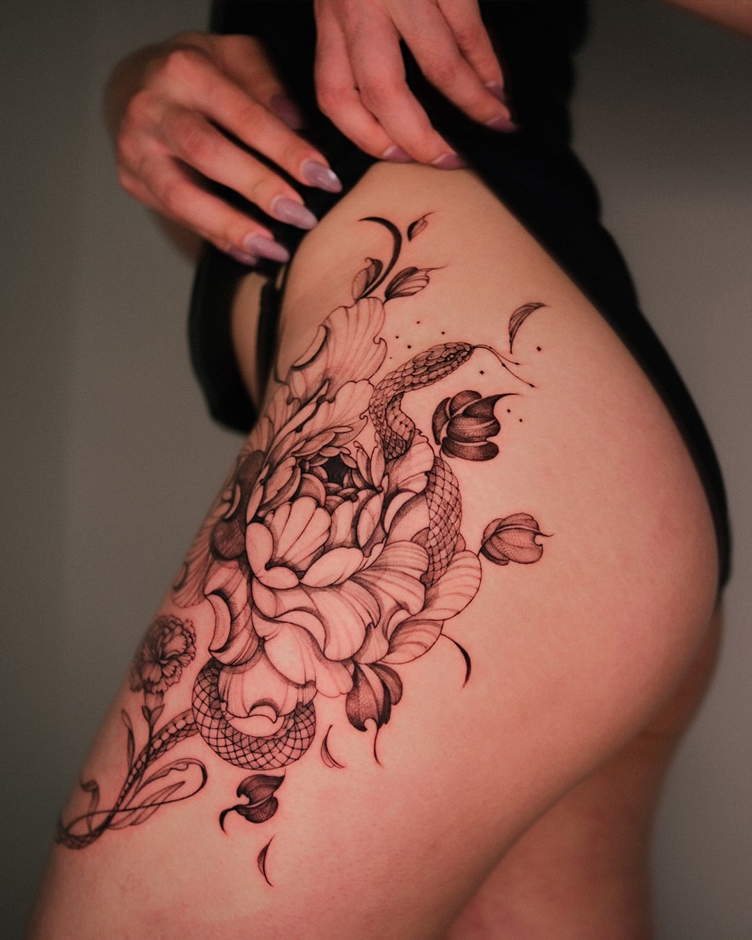Peony and snake black and grey tattoo on the thigh by Esther ✣ Fine Line Floral Tattoo Artist LA, Los Angeles, California