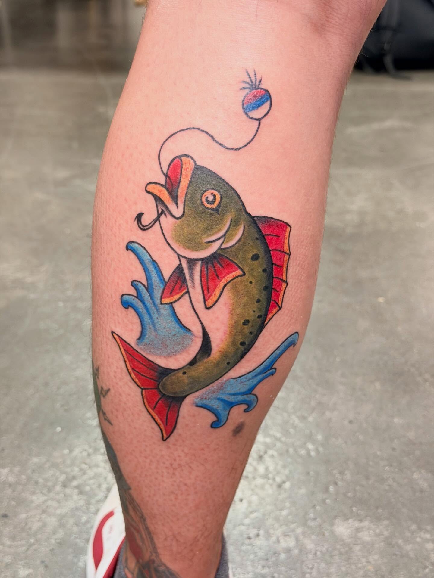 Fish American traditional tattoo on the forearm by Ellari