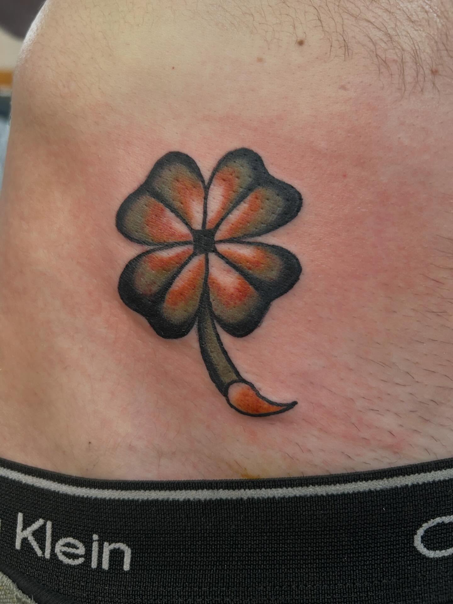 Four-leaf clover American traditional tattoo on the thigh by Donny
