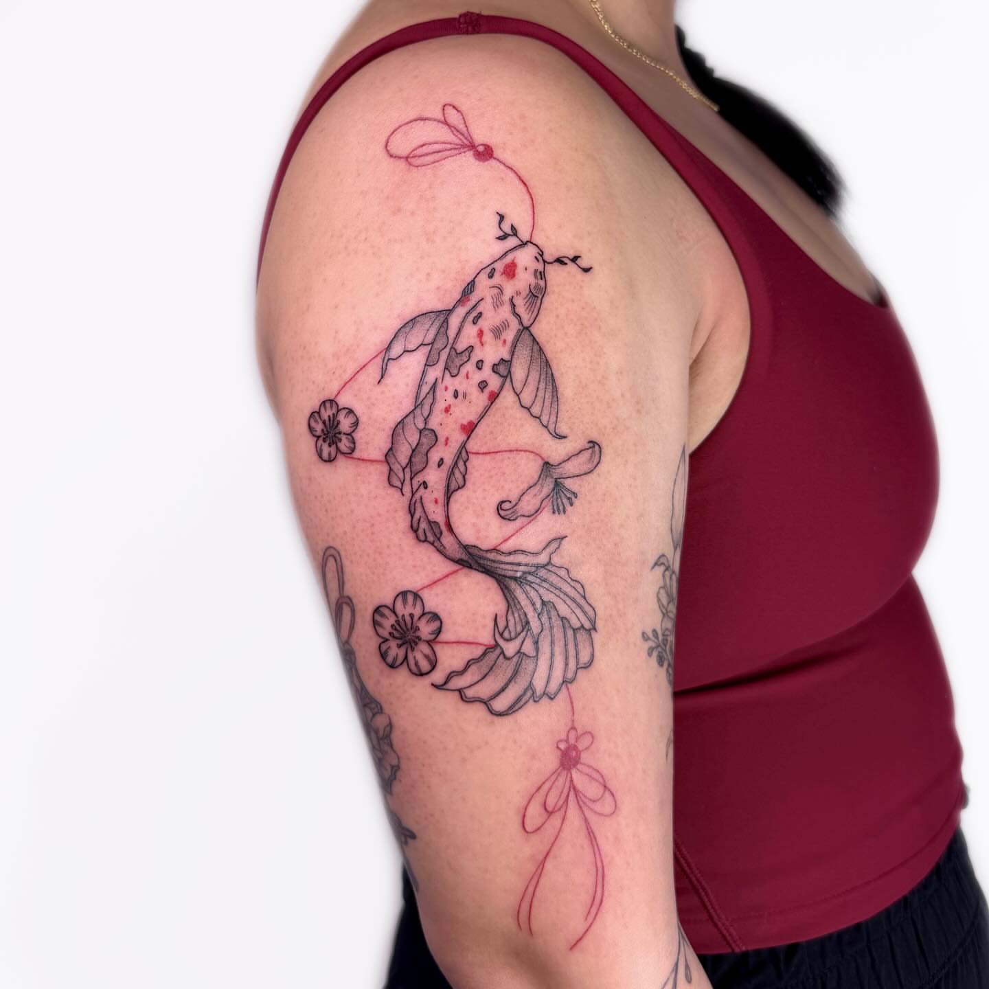 Koi fish japanese irezumi tattoo on the upper arm by Nika