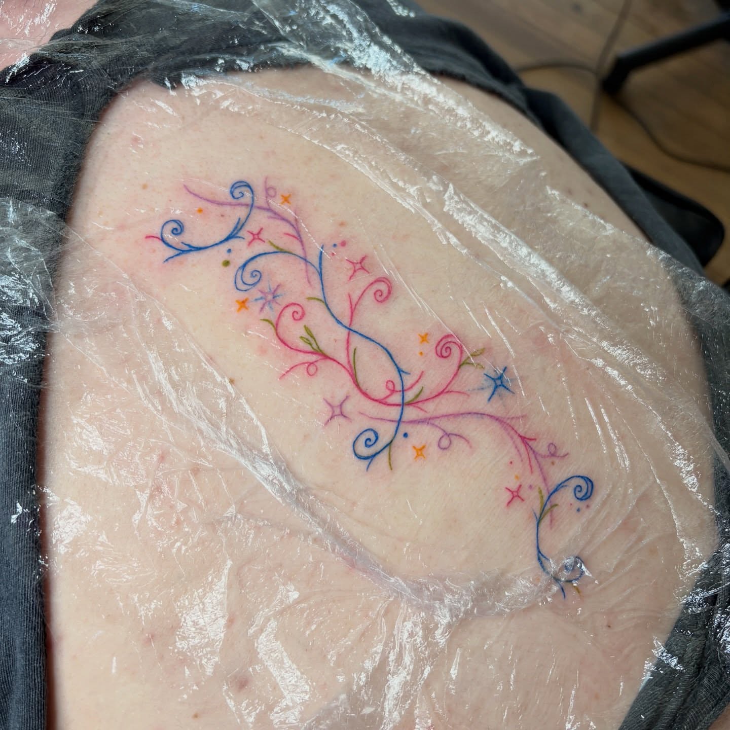 Floral vine fine line tattoo on the shoulder by Emma🌸✨Austin Tattoo Artist