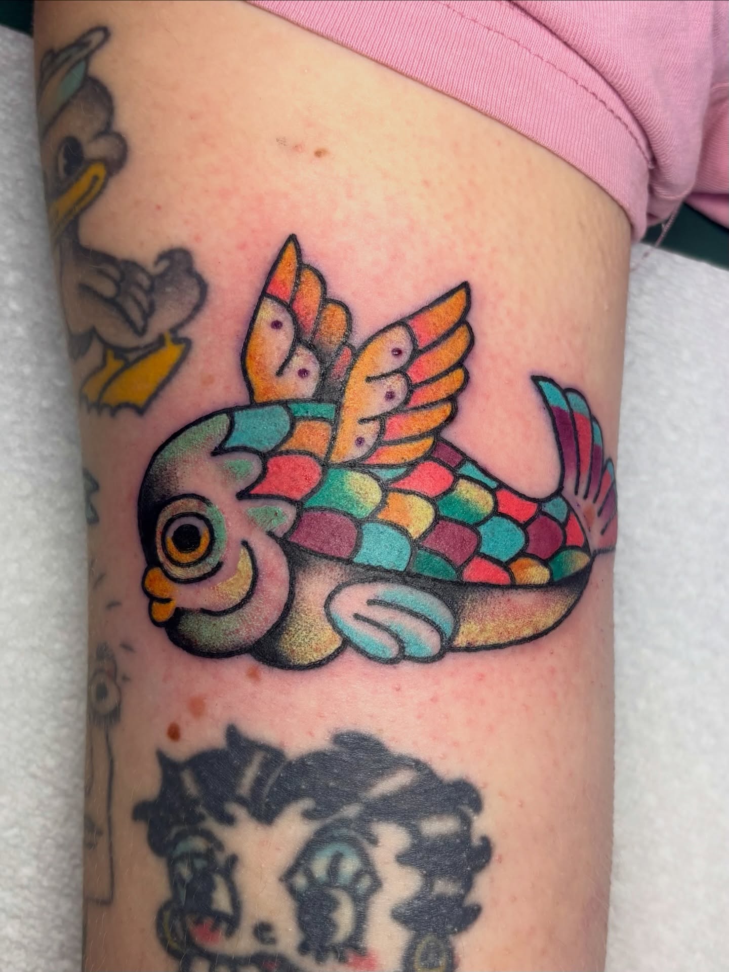 Fish with wings American traditional tattoo on the forearm by edith🌷, Murfreesboro, Tennessee