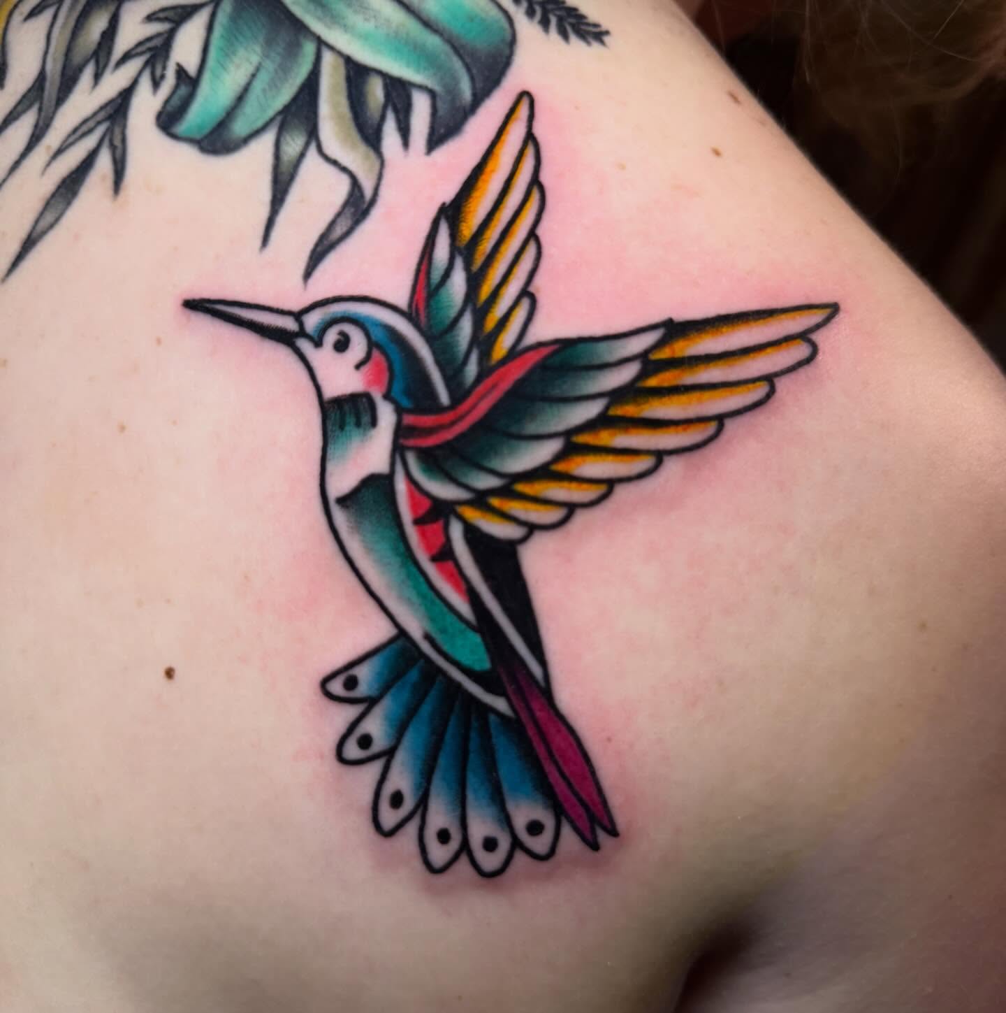 Hummingbird American traditional tattoo on the shoulder by Shelby