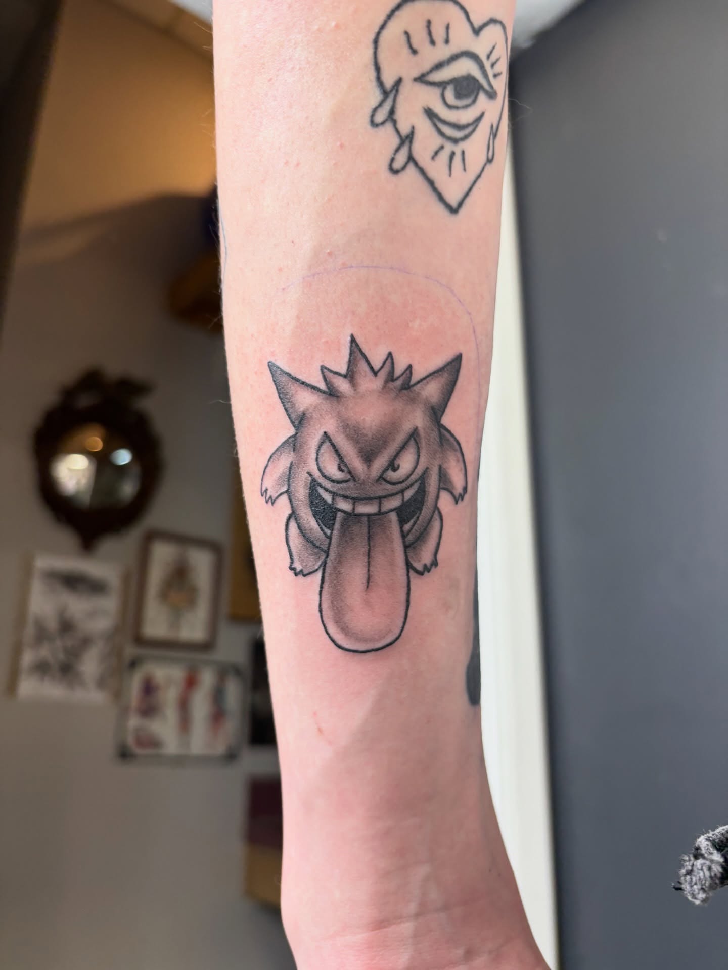 Geodude black and grey tattoo on the forearm by Noah Blum