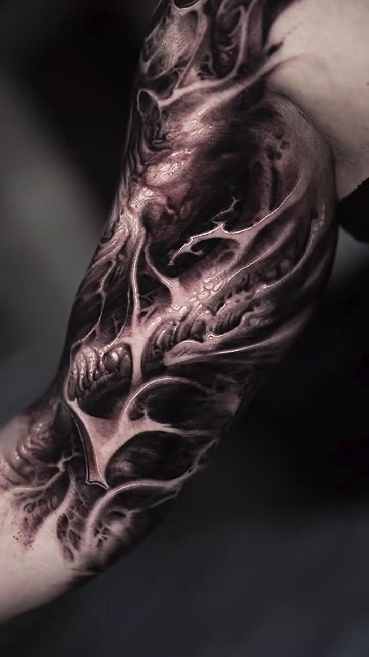Biomechanical abstract sleeve realism tattoo on the upper arm by Victor Portugal Tattoo