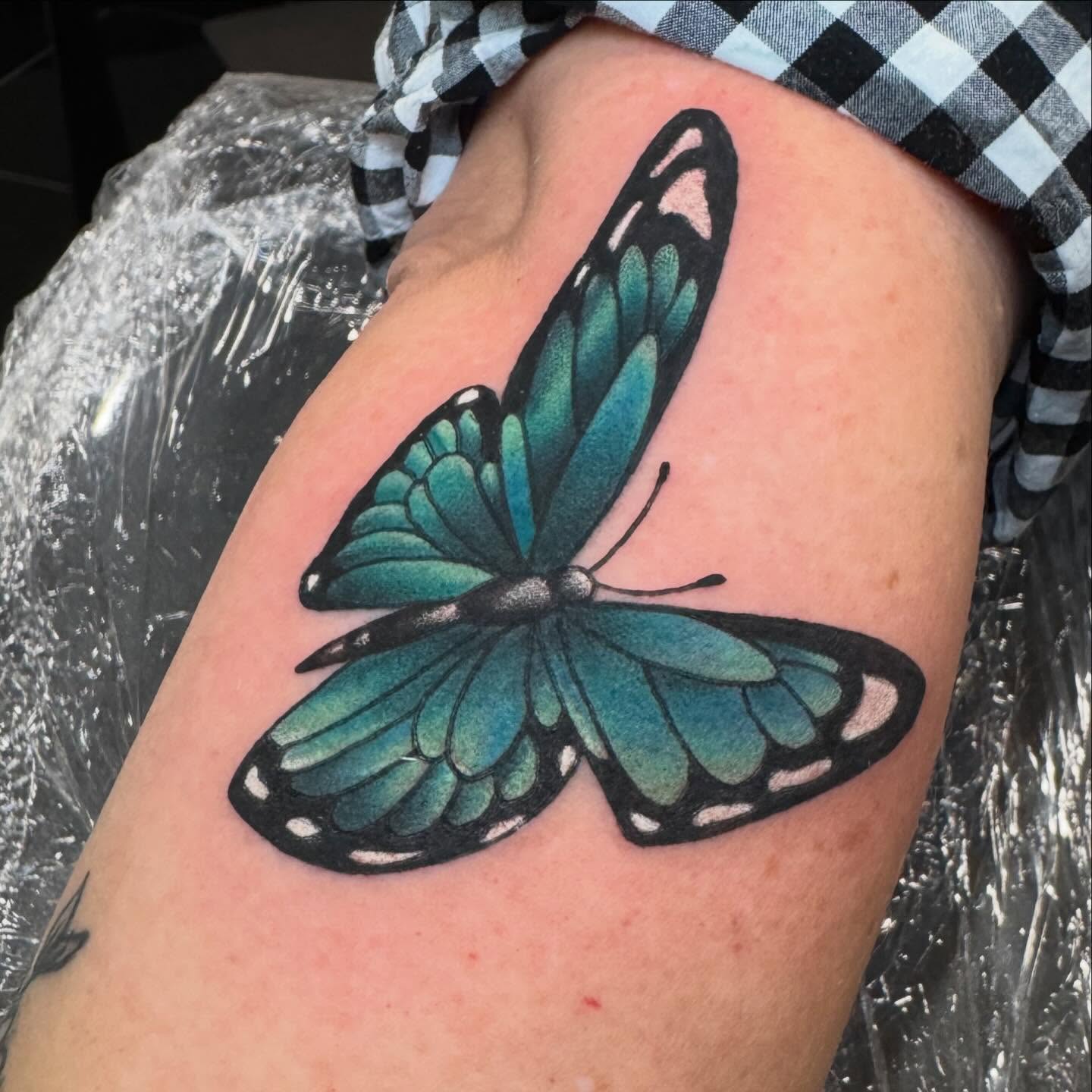 Butterfly realism tattoo on the thigh by Brian Herrera