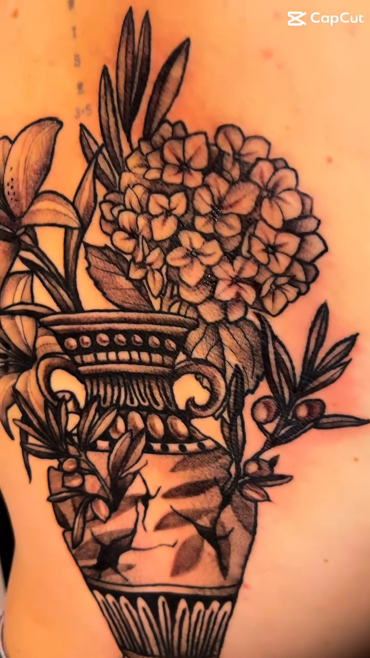 Vase with flowers sketch tattoo on the back by Jes Petrie Tattoos