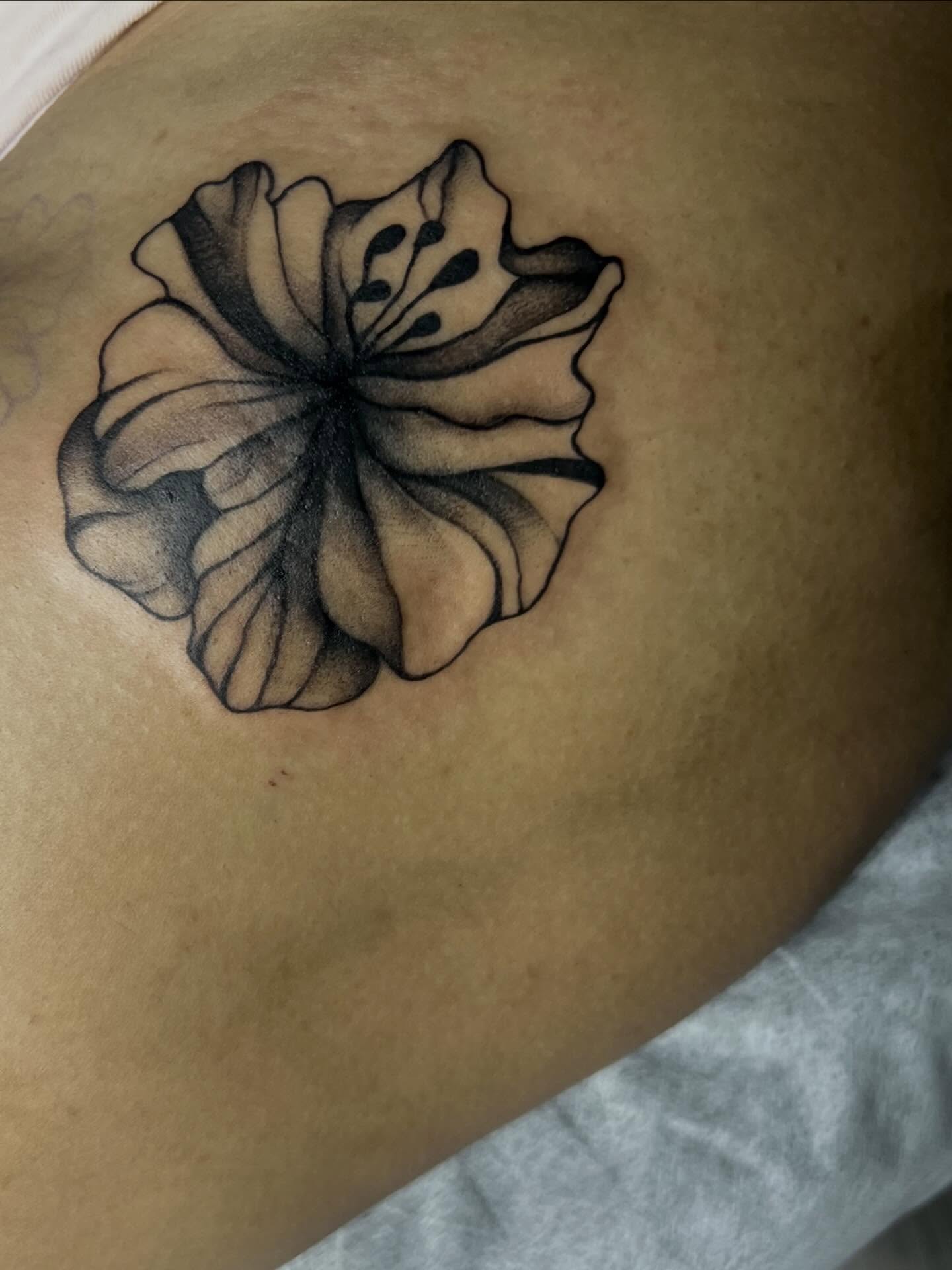Flower dotwork tattoo on the thigh by Haiiitattoo