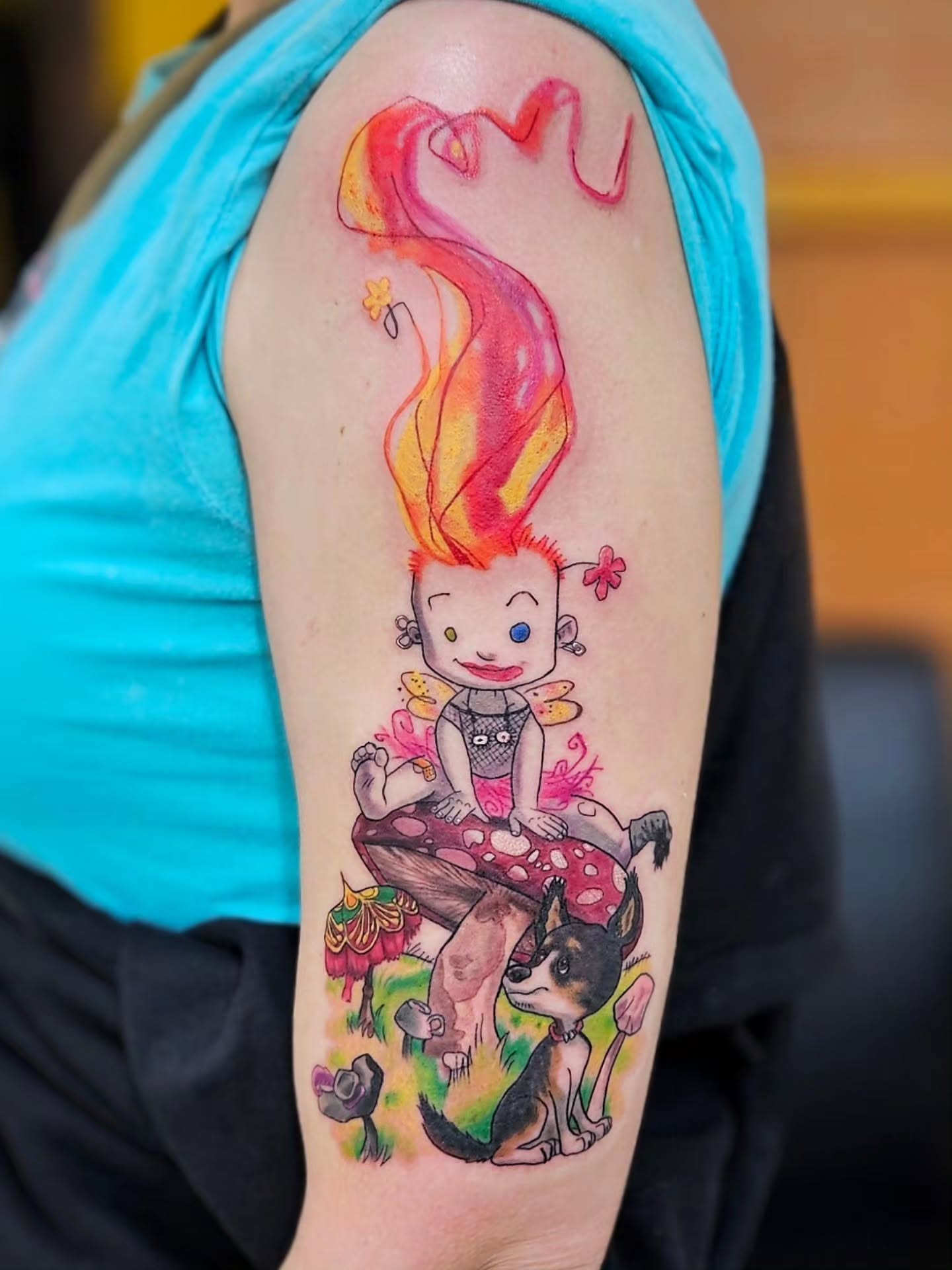 Elf with dog watercolor tattoo on the forearm by Jordanna Pearl