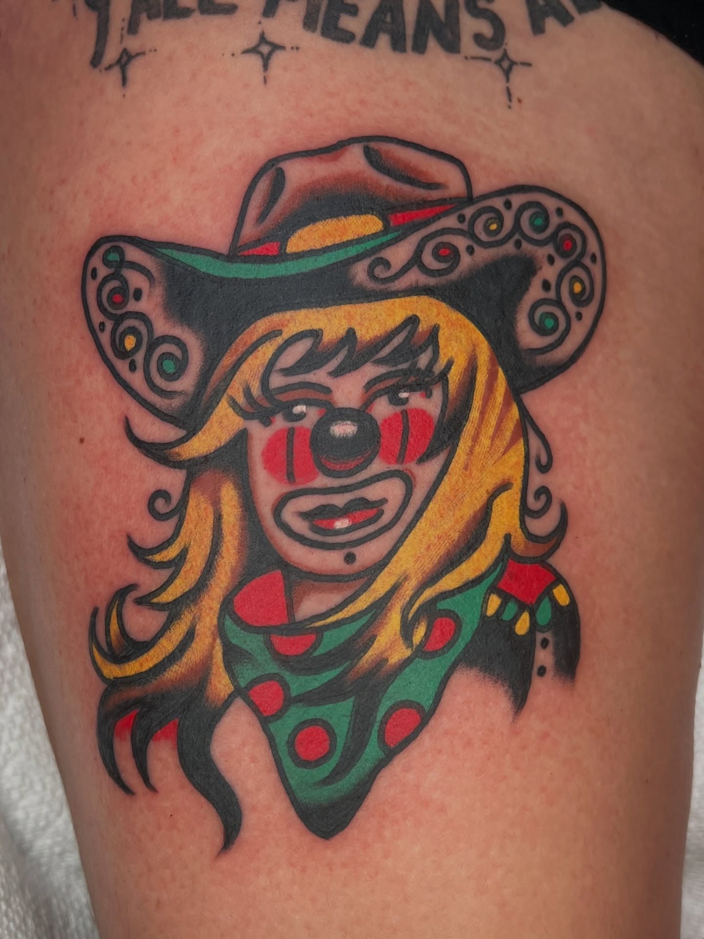 Clown American traditional tattoo on the thigh by 💥Jeff Klug💥, Austin, Texas