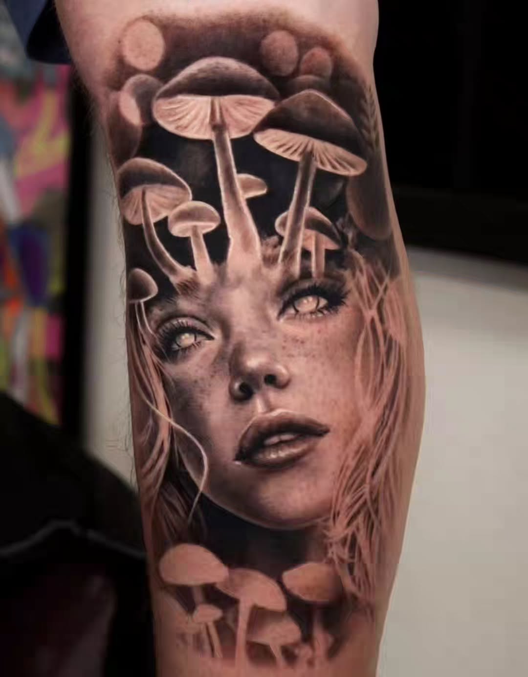 Woman's face with mushrooms surrealism tattoo on the forearm by Brandon Rabago, Fort Worth, Texas