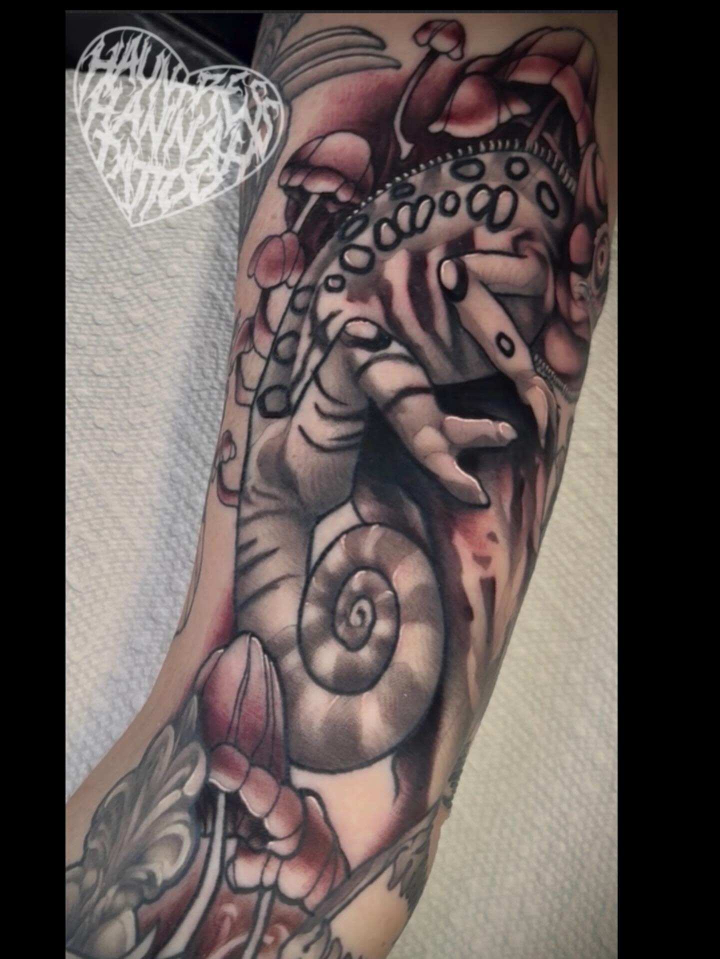 Octopus and nautilus shell realism tattoo on the forearm by Hannah Casadonti