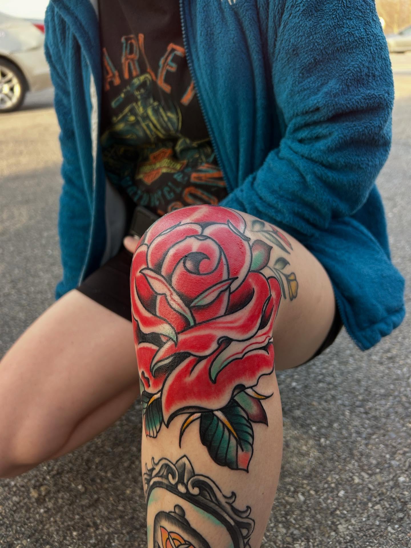 Rose American traditional tattoo on the thigh by Dylan O'Quin
