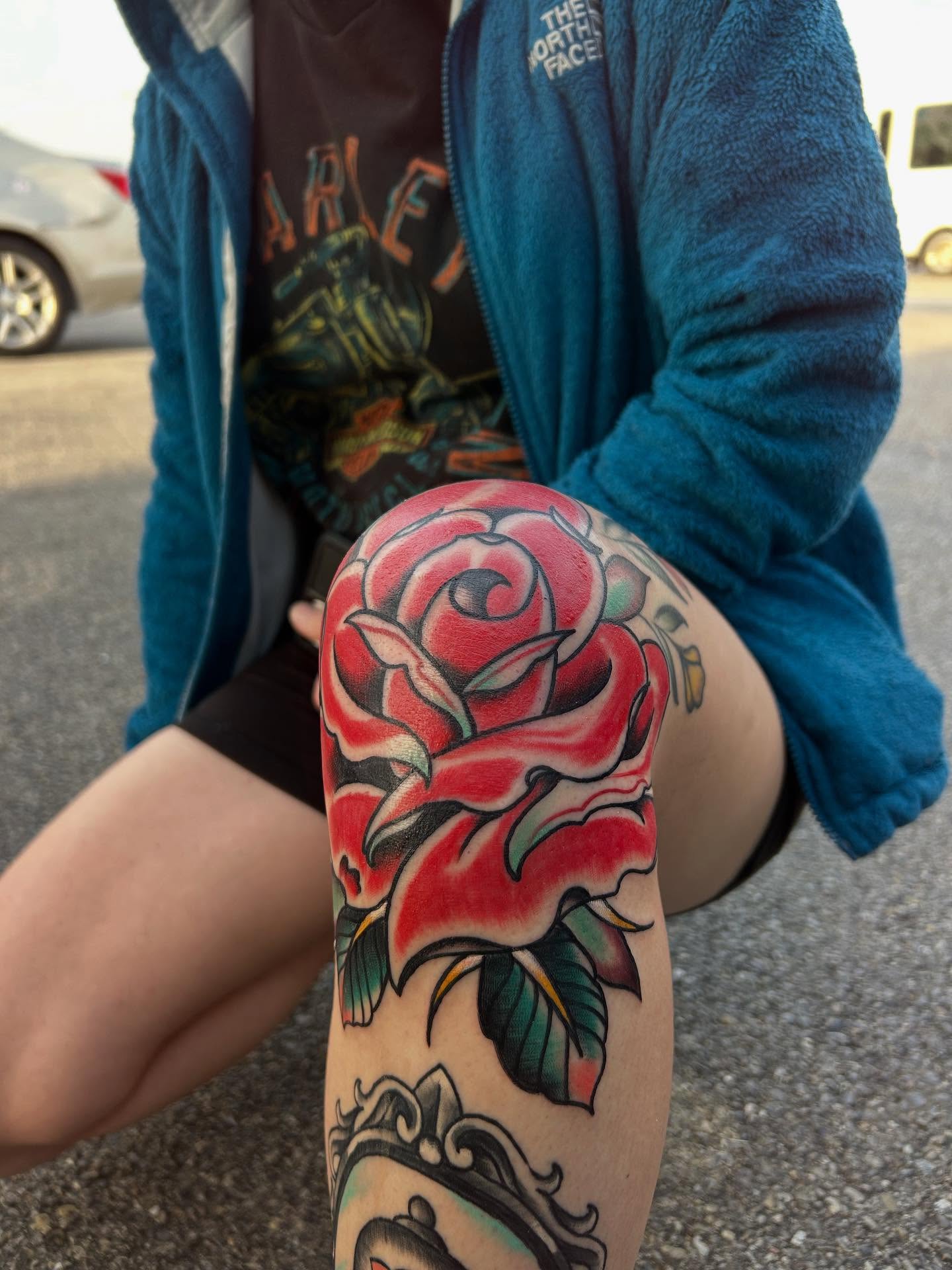 Red rose American traditional tattoo on the forearm by Dylan O'Quin