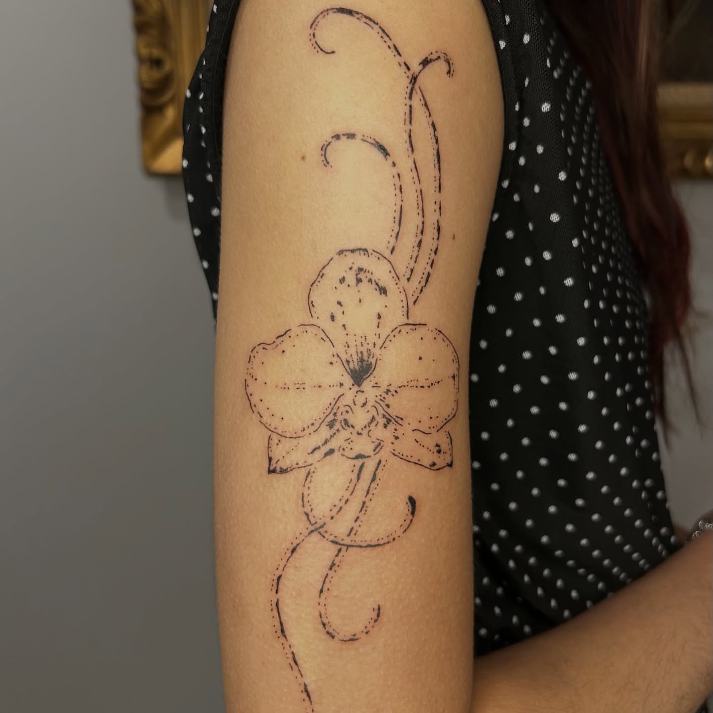 Orchid dotwork tattoo on the forearm by wanderfernfairy