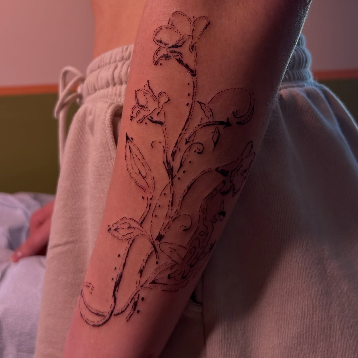 Floral vine dotwork tattoo on the forearm by wanderfernfairy
