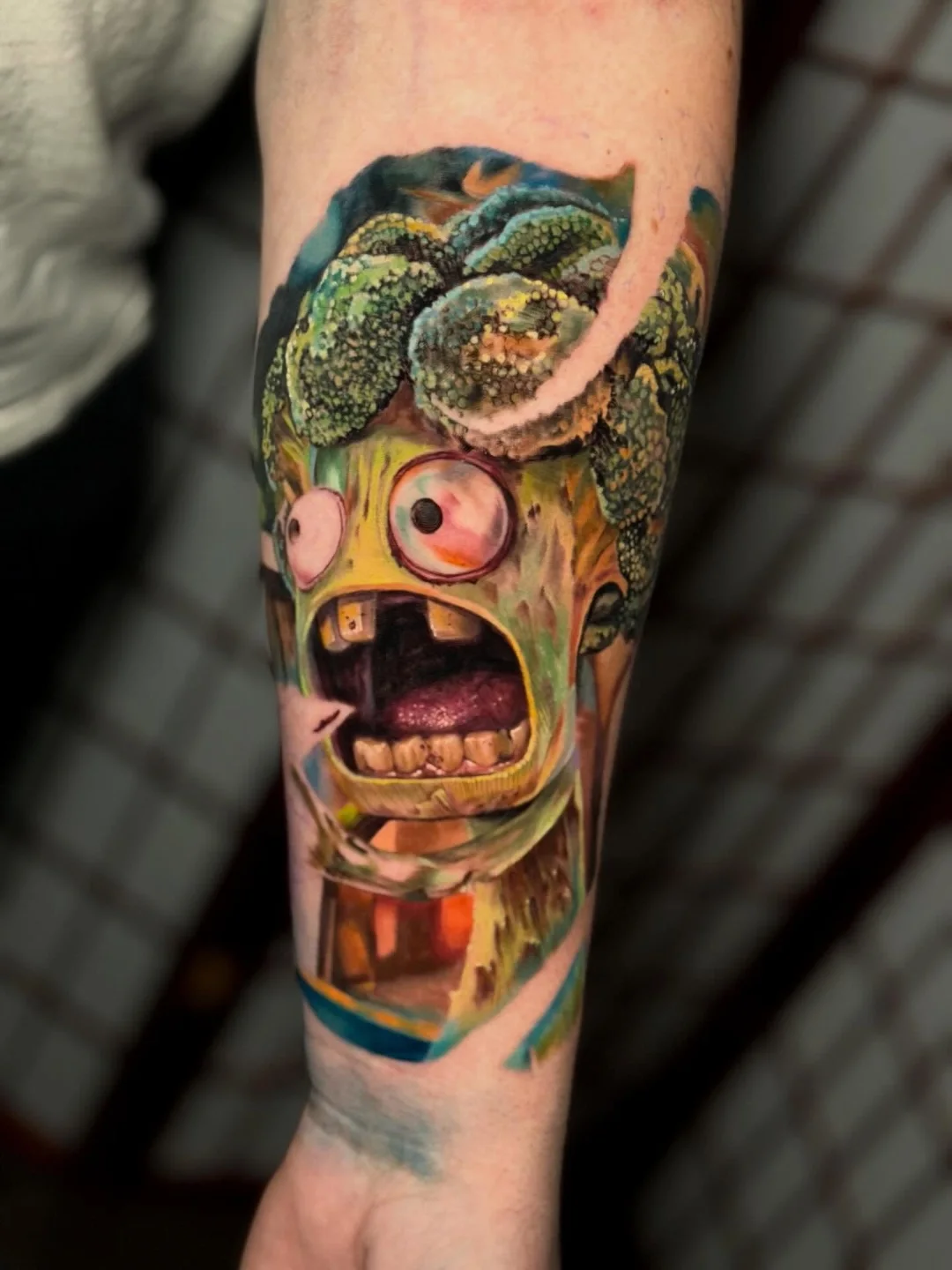 Monster head realism tattoo on the forearm by Johnny Scillieri