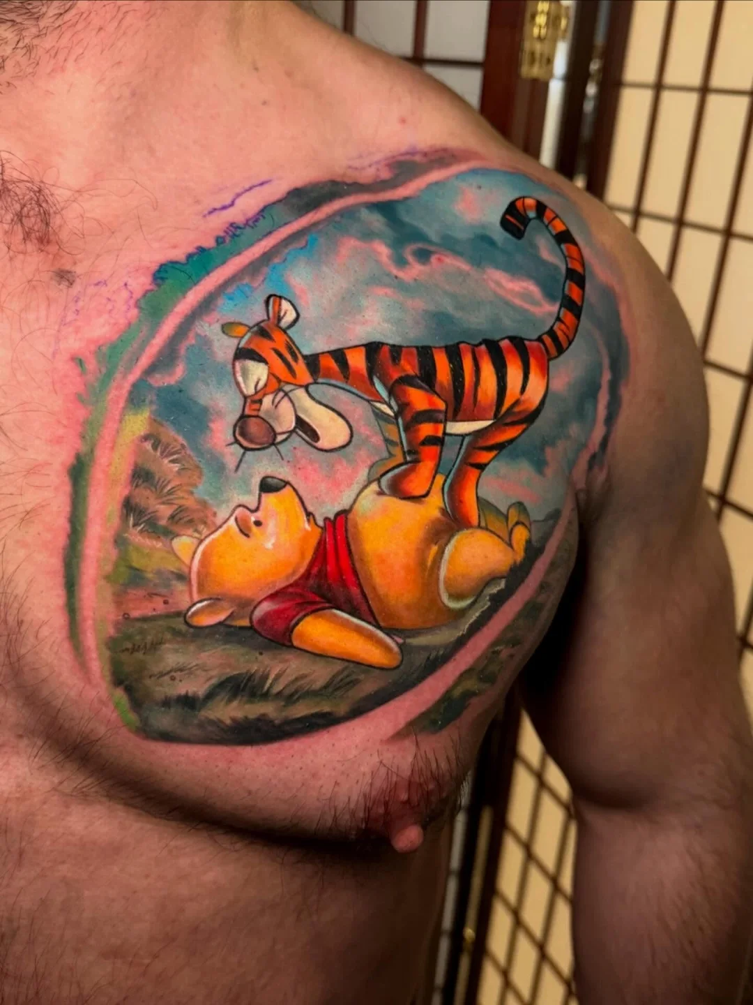 Winnie the Pooh and Tigger realism tattoo on the shoulder by Johnny Scillieri
