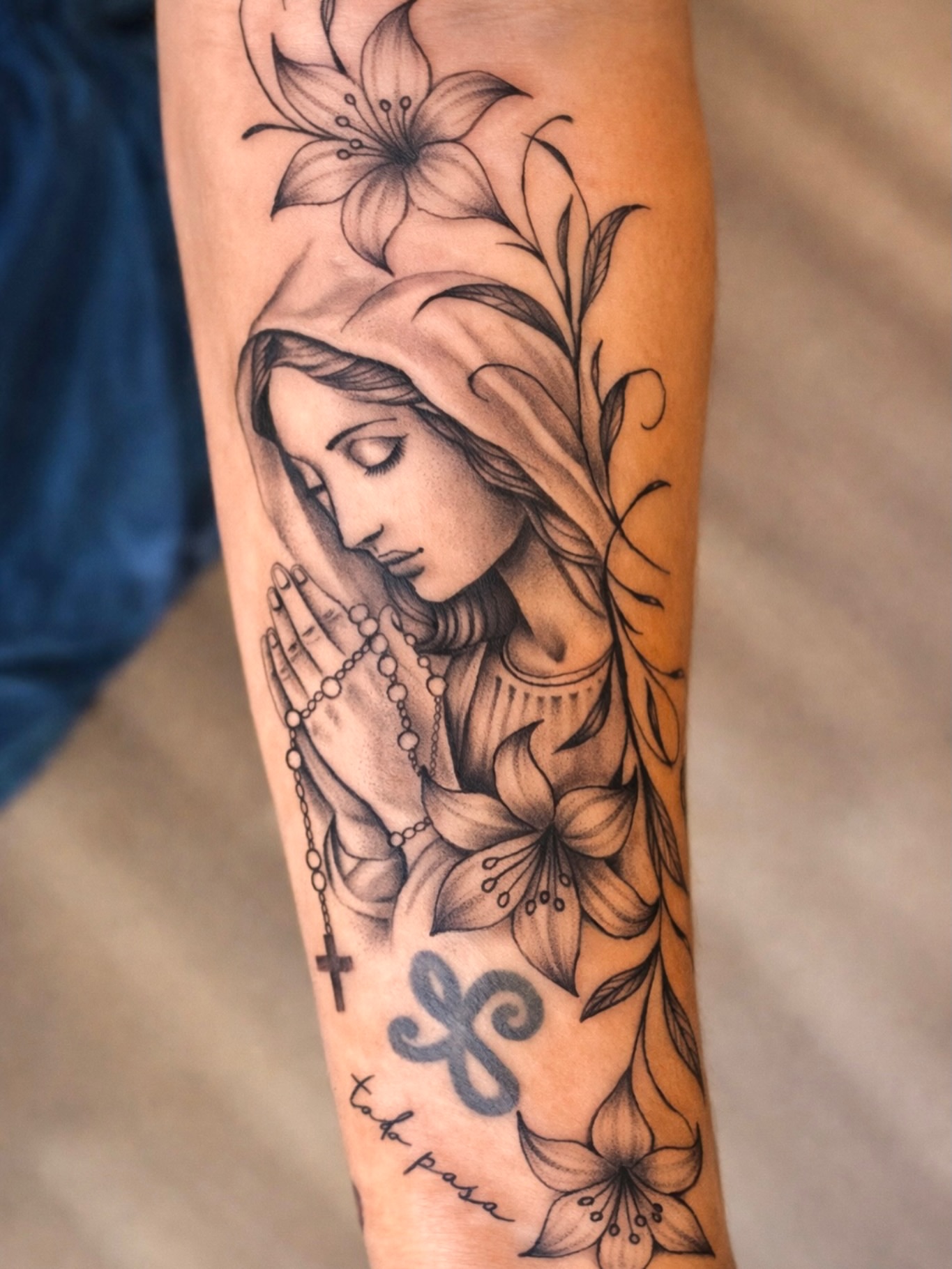 Praying woman realism tattoo on the forearm by Kate