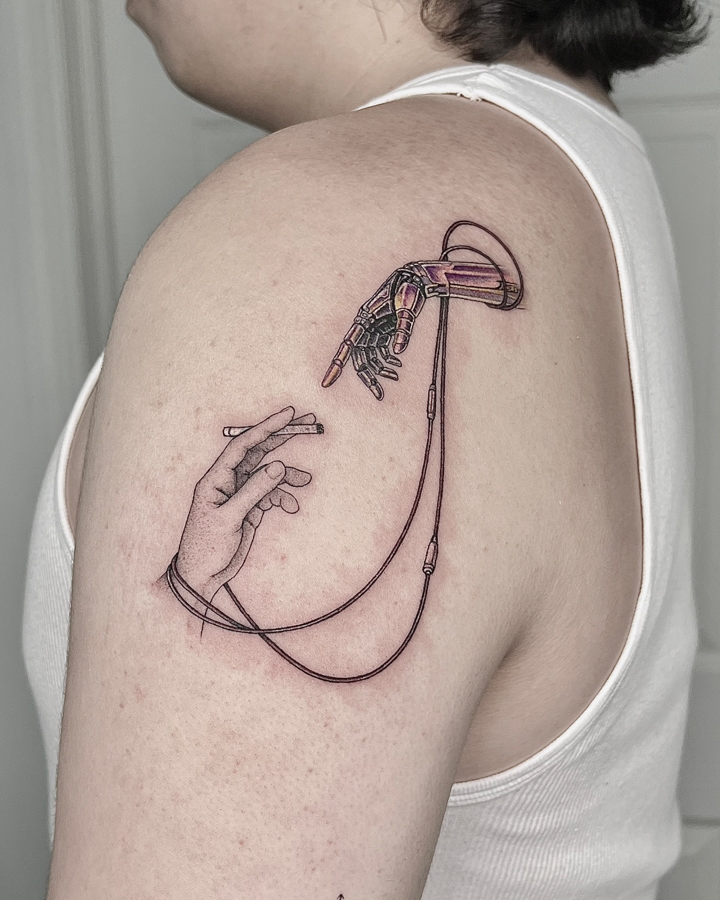 Robotic hand and cigarette realism tattoo on the shoulder by X°