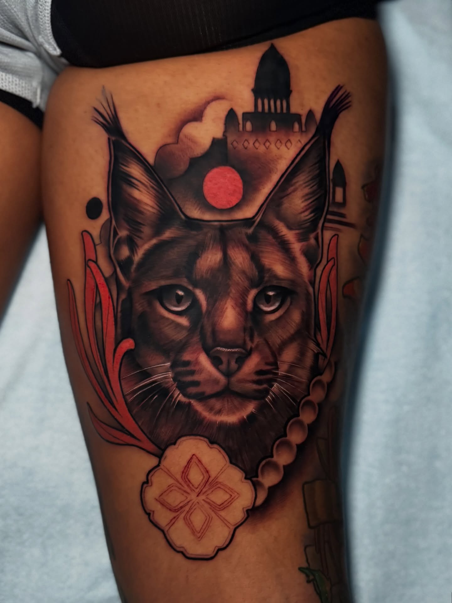 Cat realism tattoo on the thigh by Jaxx Kesler