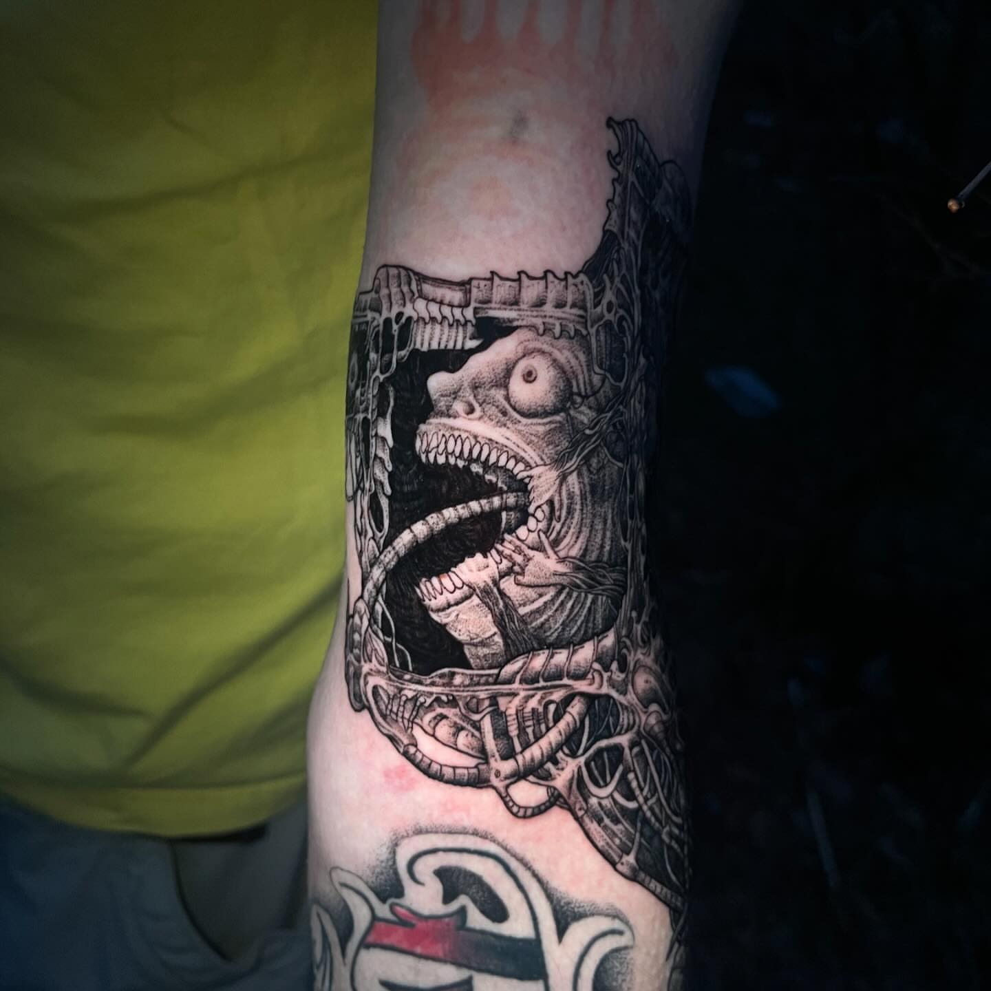 Biomechanical creature realism tattoo on the forearm by Crawlspacecadet
