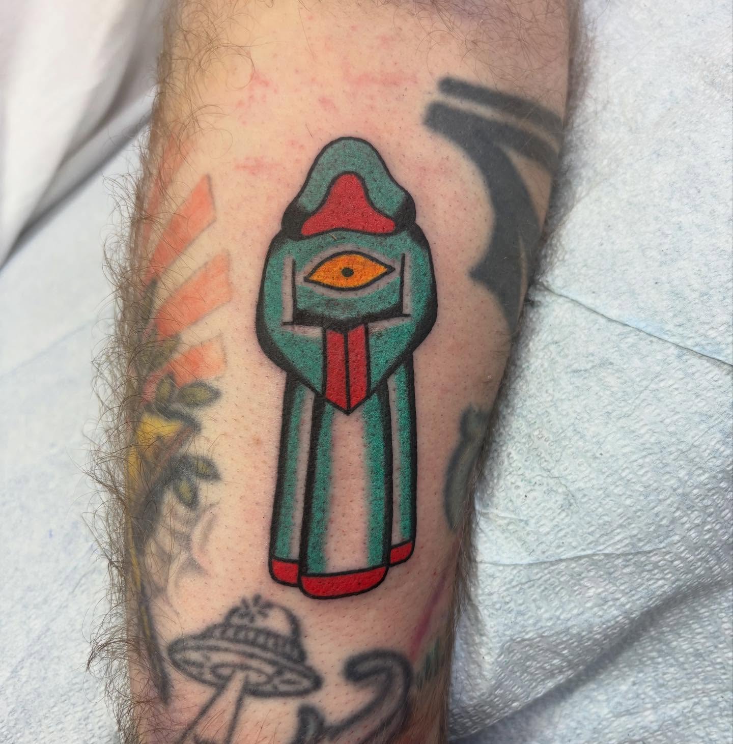 Alien figure American traditional tattoo on the forearm by dayton skuse, Portland, Oregon