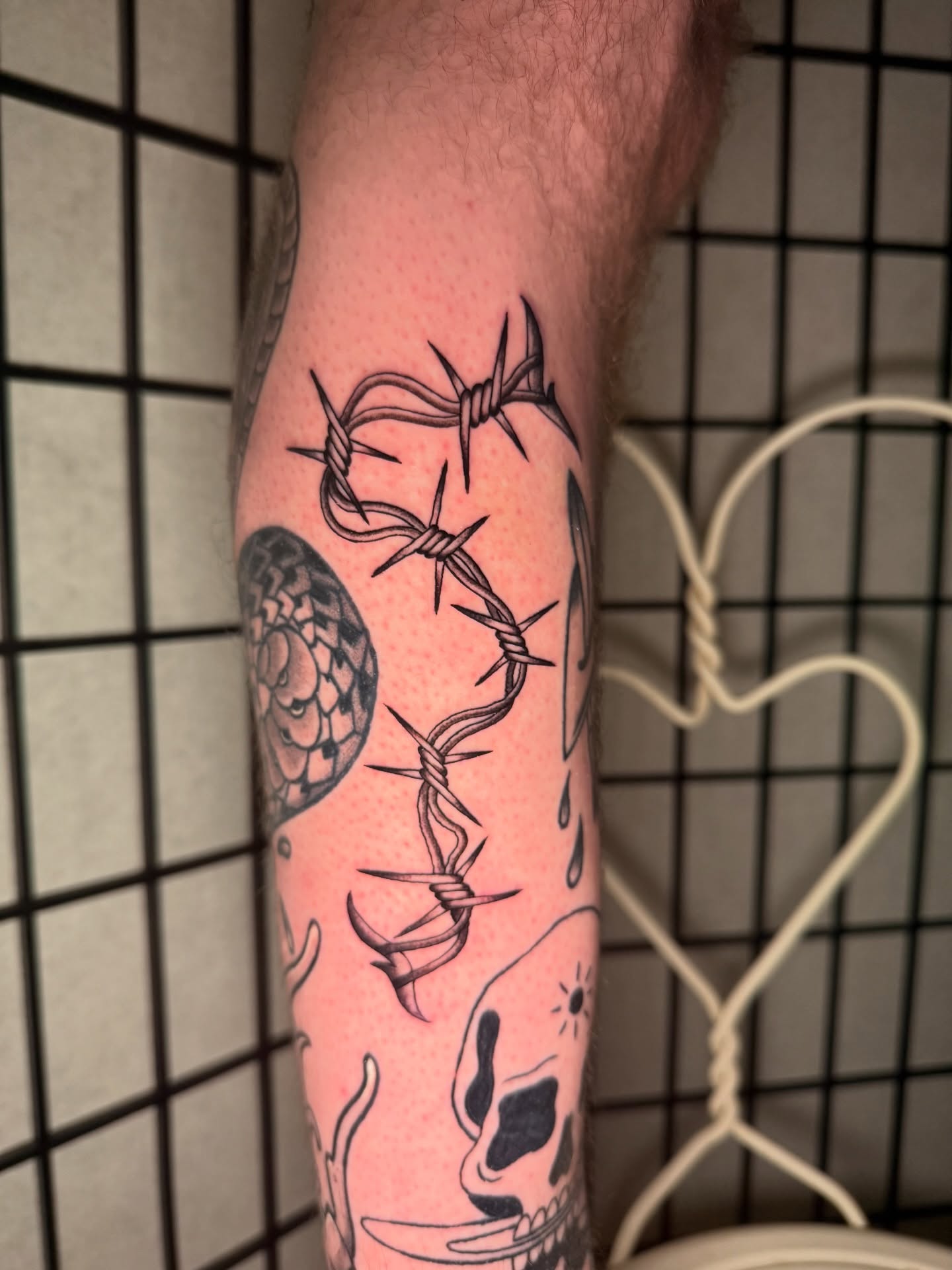 Barbed wire black and grey tattoo on the forearm by Austin Poliszuk, Minneapolis, Minnesota