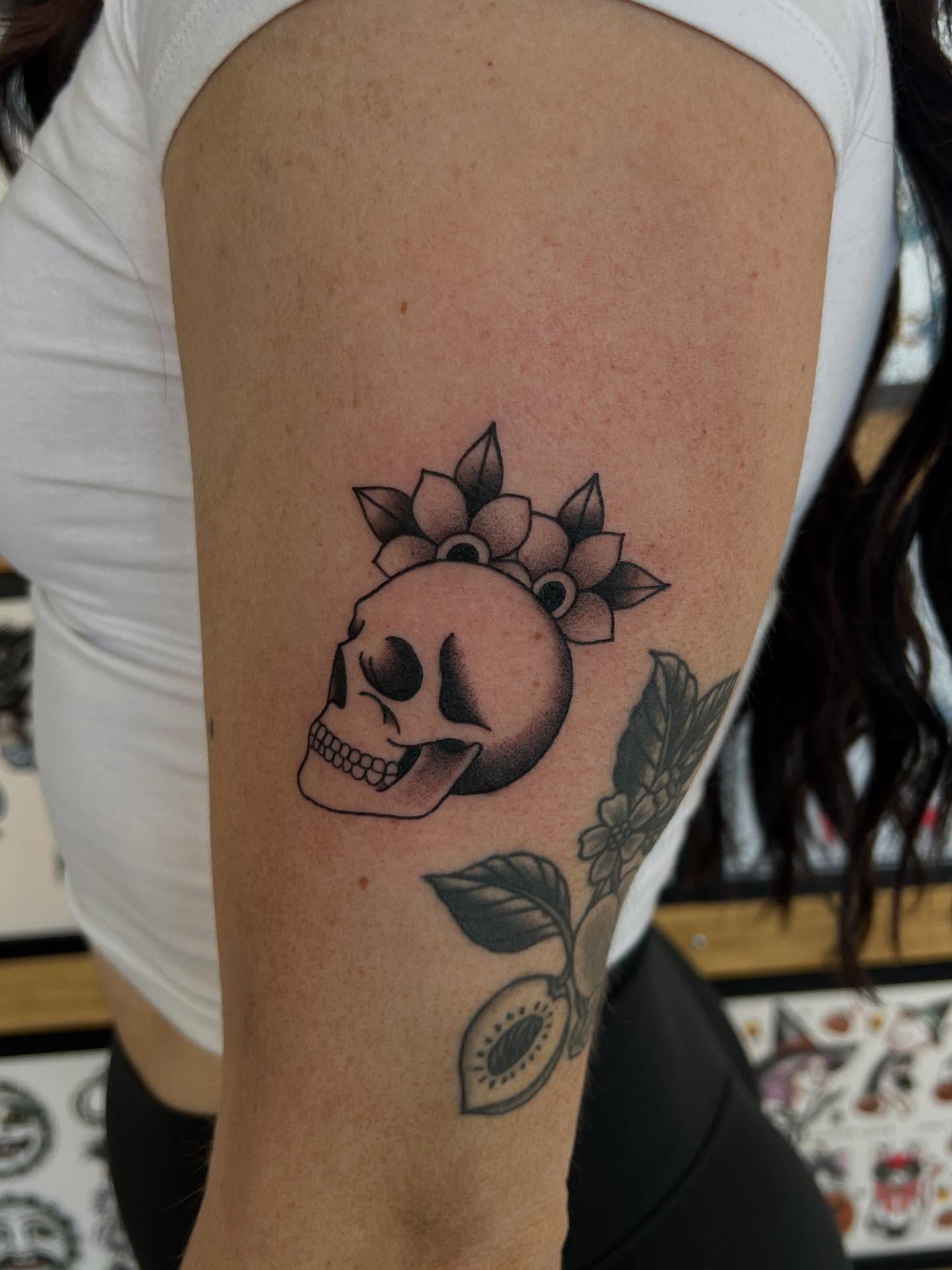 Skull with flowers black and grey tattoo on the forearm by 𝖆𝖑𝖞𝖘𝖘𝖆 ☽