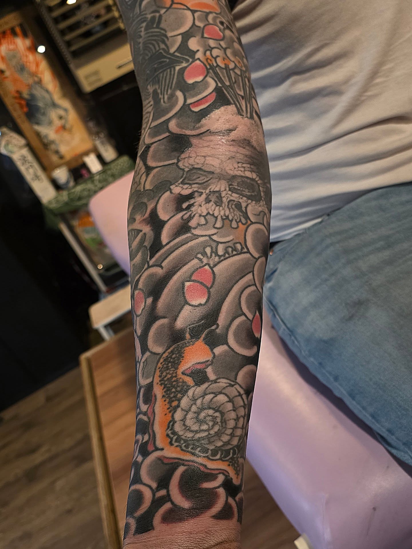 Abstract floral and skeletal motifs japanese irezumi tattoo on the forearm by Frank Simanton