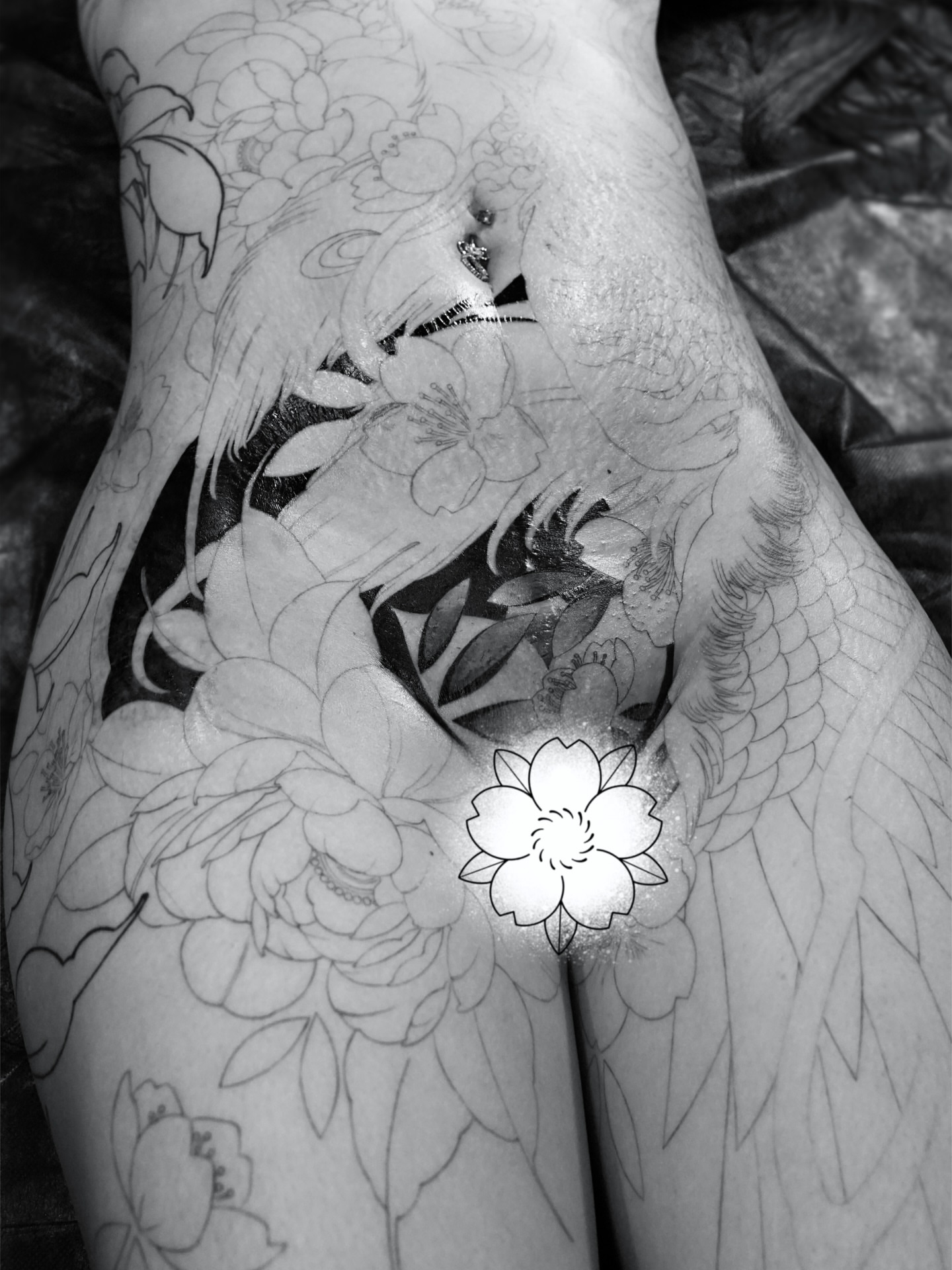Floral and bird black and grey tattoo on the thigh by Gerardo Brawder