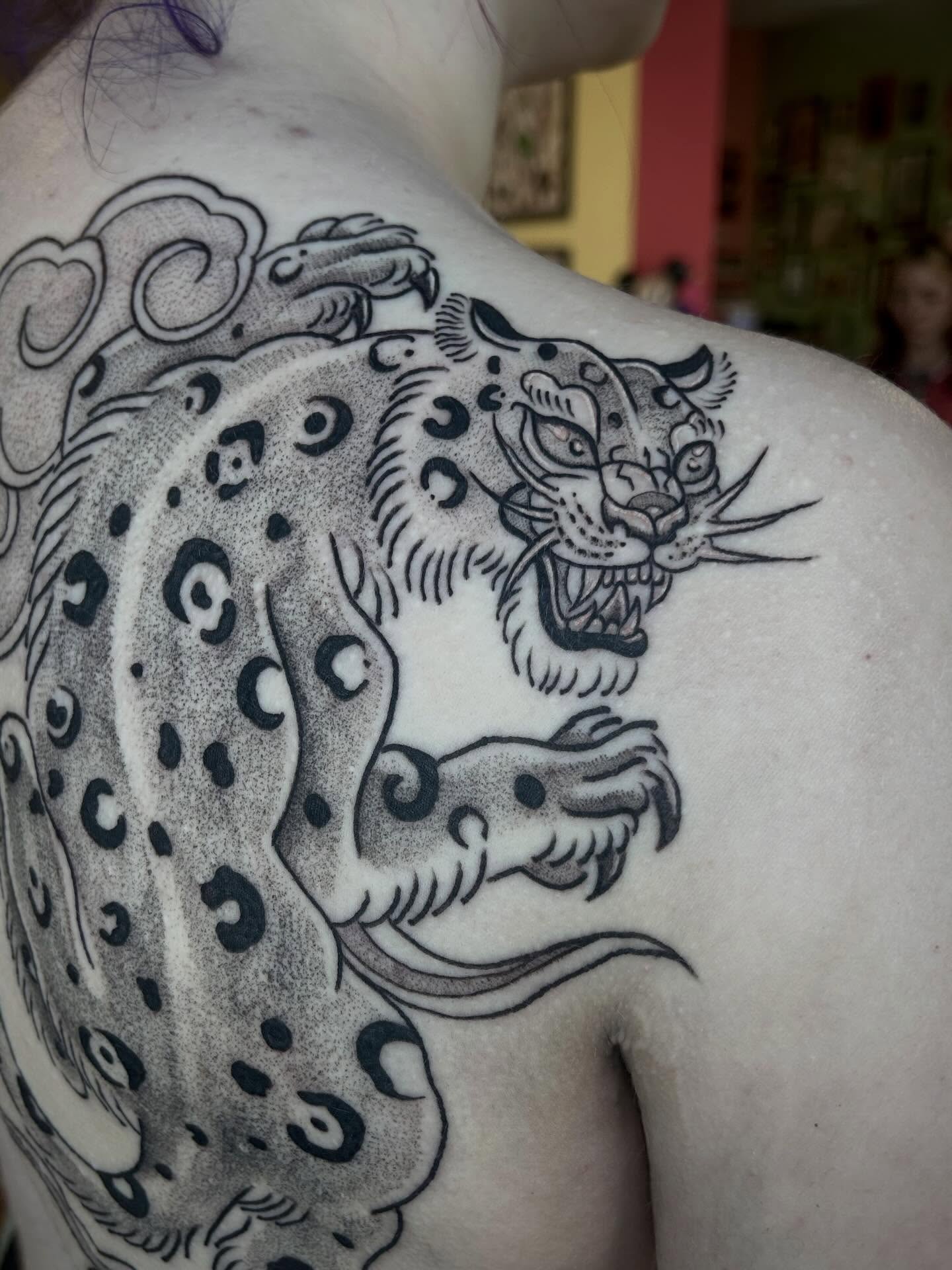 Leopard dotwork tattoo on the shoulder by Bria🩸