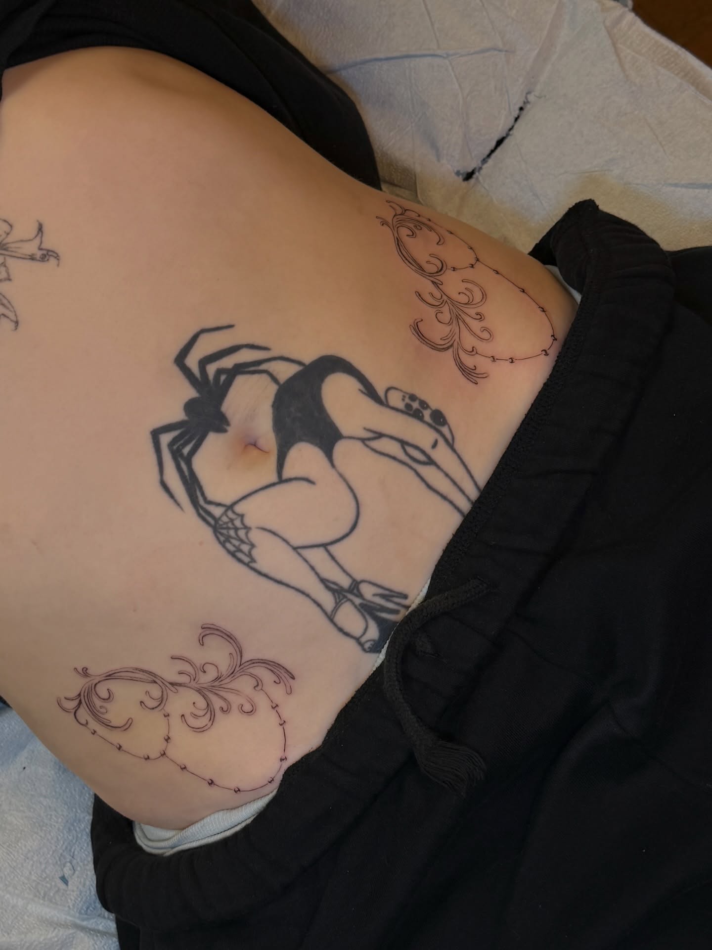 Woman with bird black and grey tattoo on the torso by Maddie Blosser, Portland, Oregon