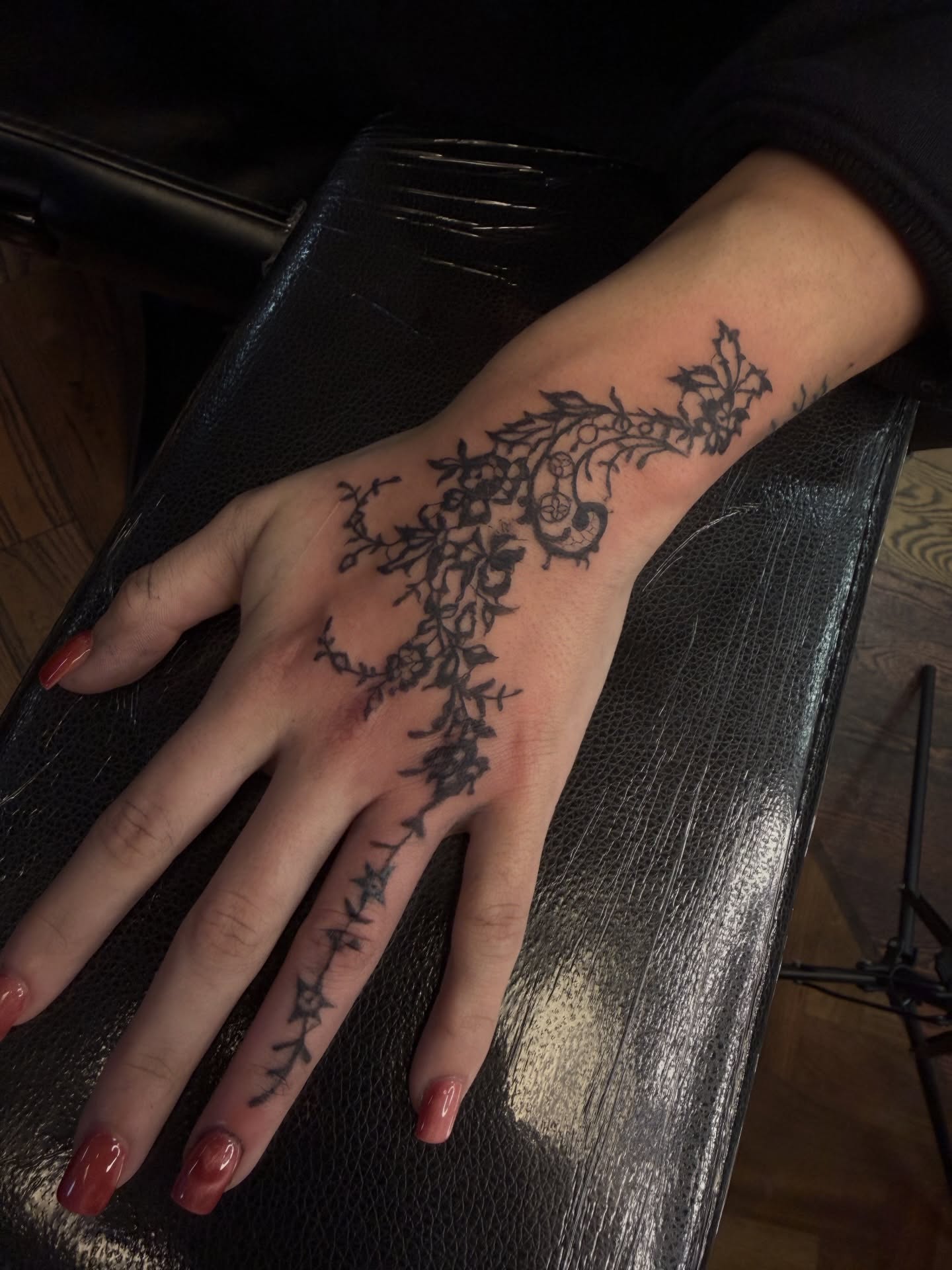 Floral vine black and grey tattoo on the hand by Maddie Blosser, Portland, Oregon