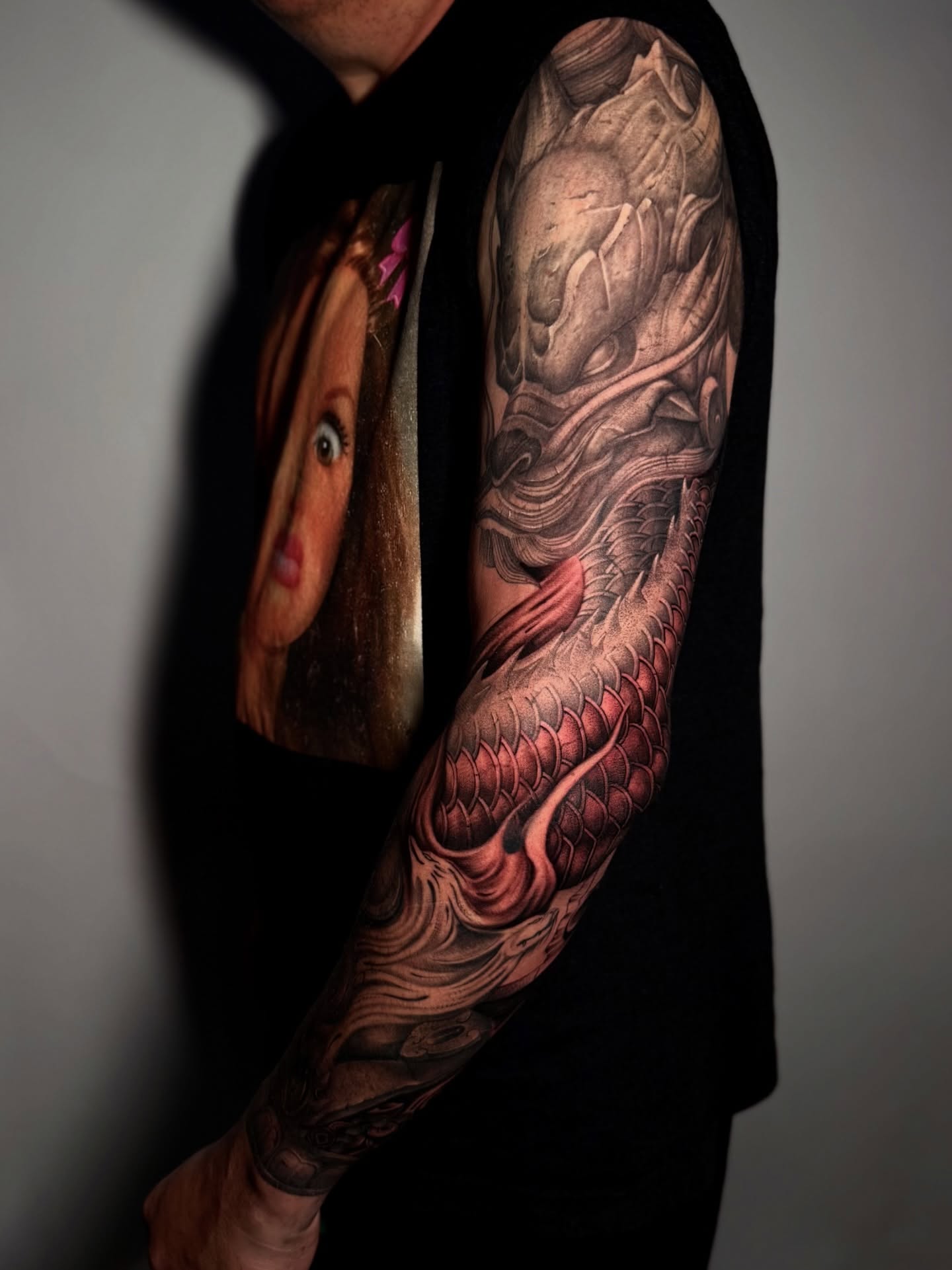 Koi fish realism tattoo on the upper arm by Anh Nguyen